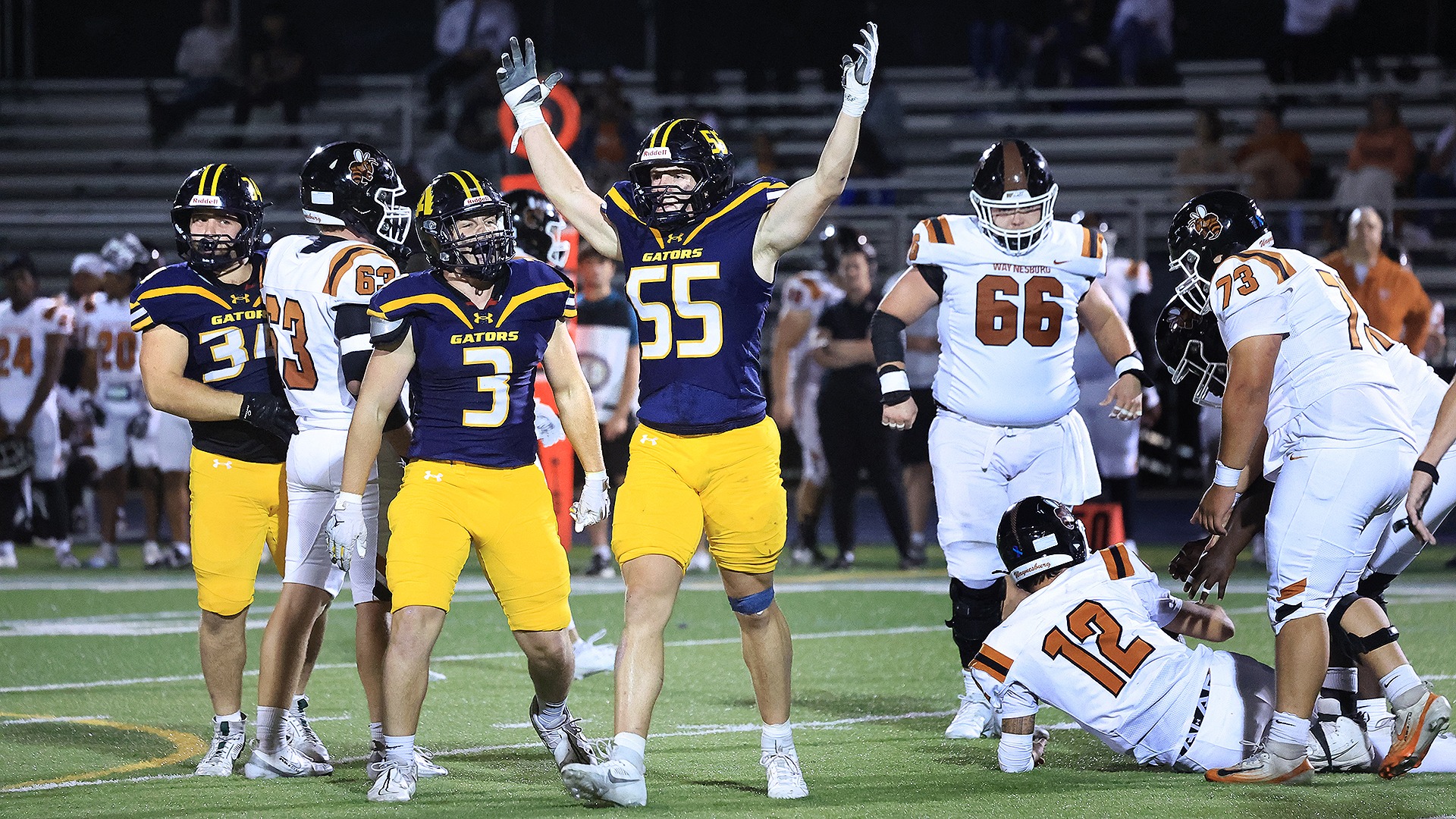 Drew Evans celebrates defensive stop vs. Waynesburg, Sept. 19, 2026. Photo by Ed Mailliard.