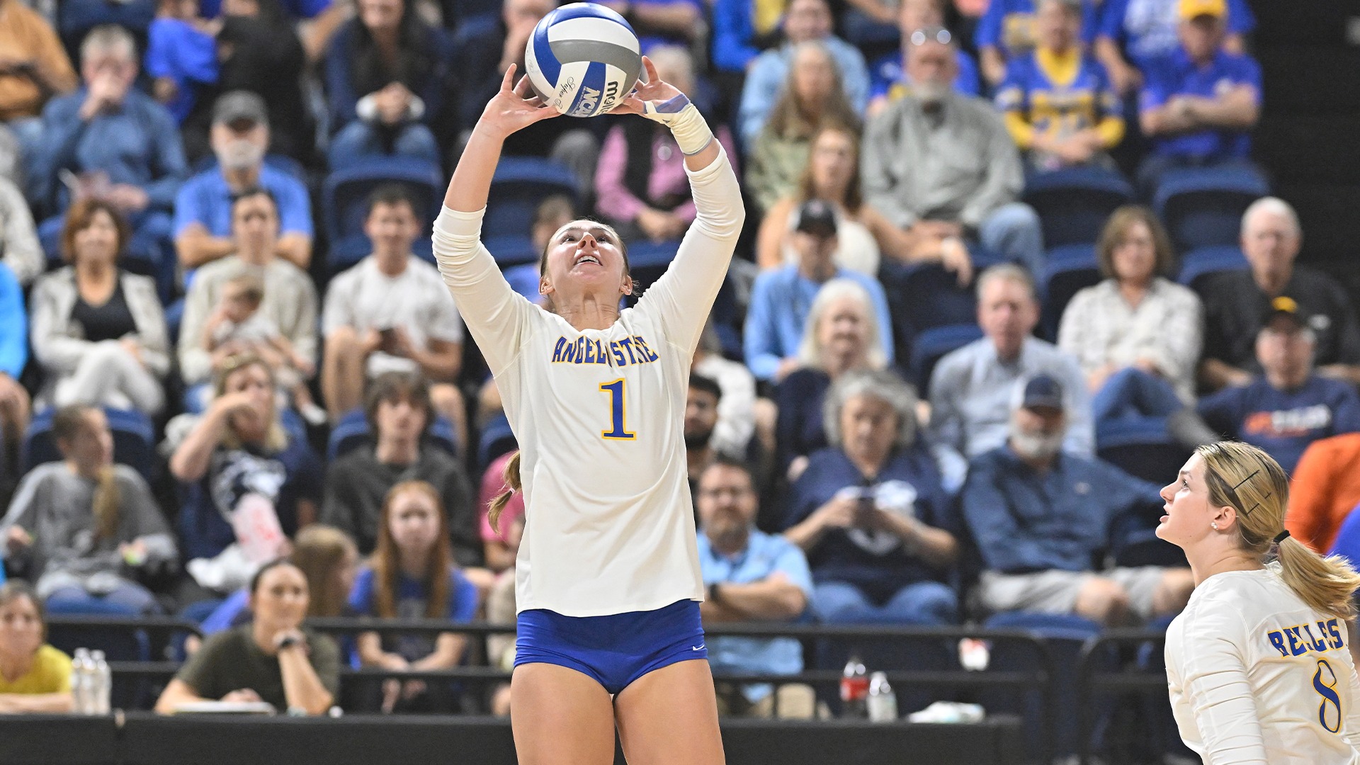 Adeline Ortman sets a ball vs. UTT