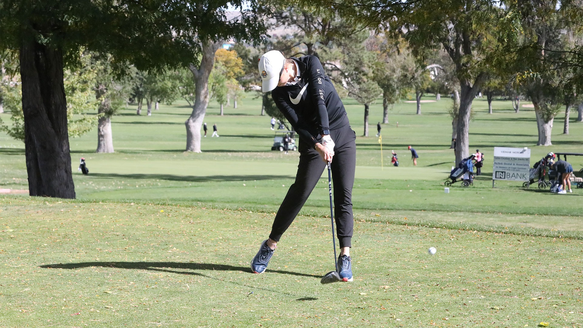 Mia Clarke hits a ball off the tee.