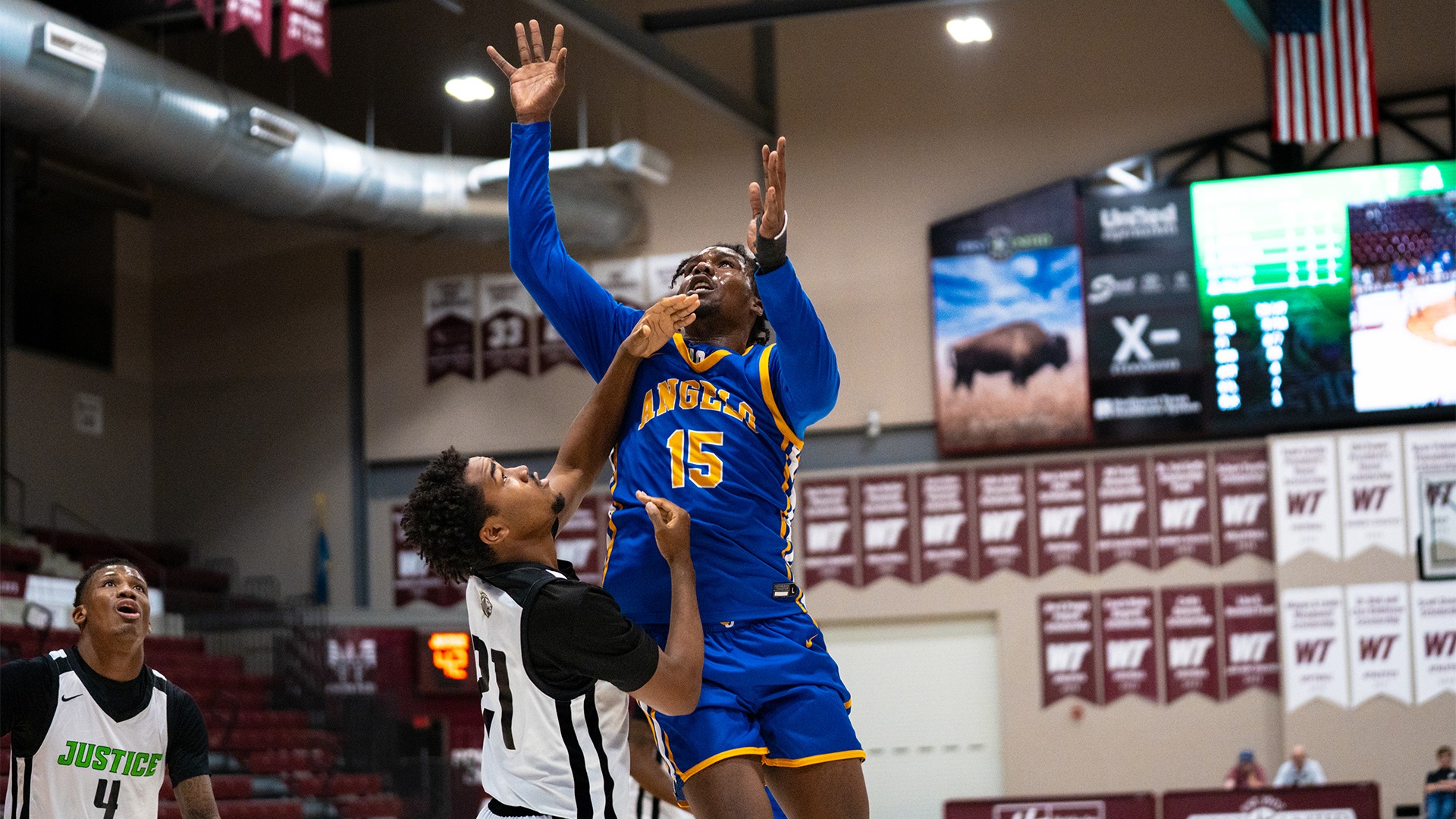 Jaqai Murray shoots a layup vs. Justice