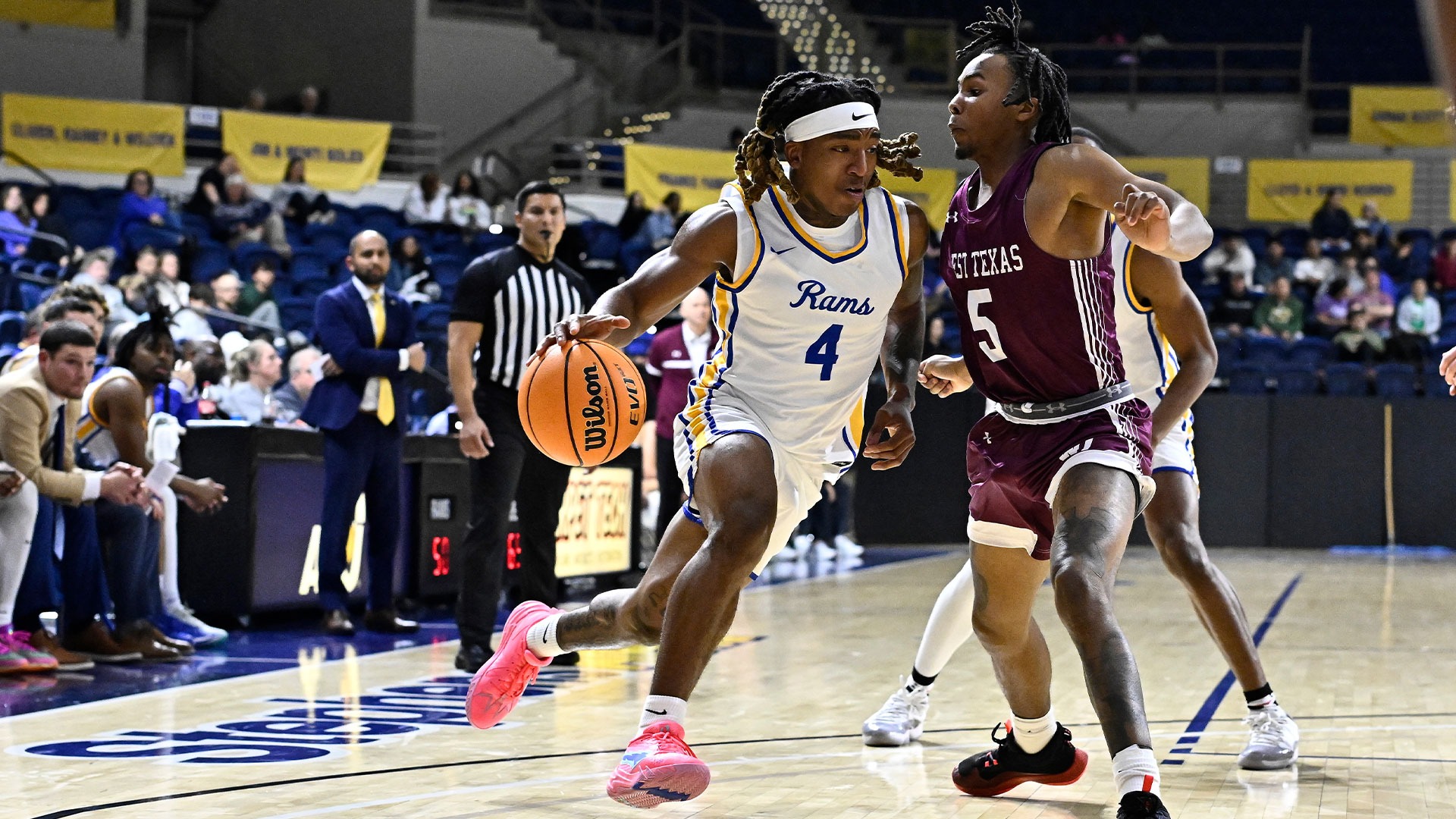 Kendrick Delahoussaye drives the lane vs. WT