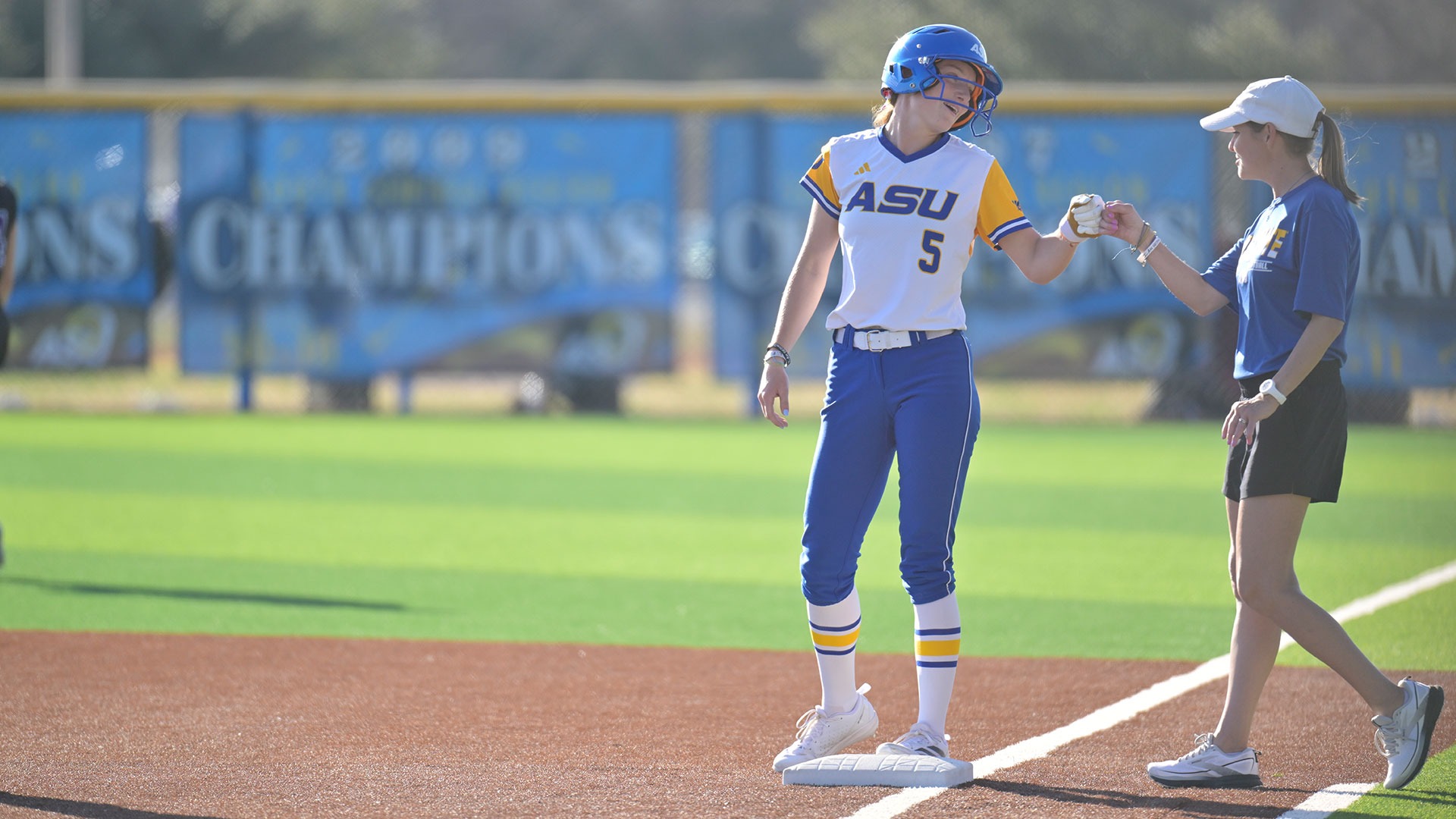 Erin Plunkett fist bumps Katie Scott vs. Ouachita