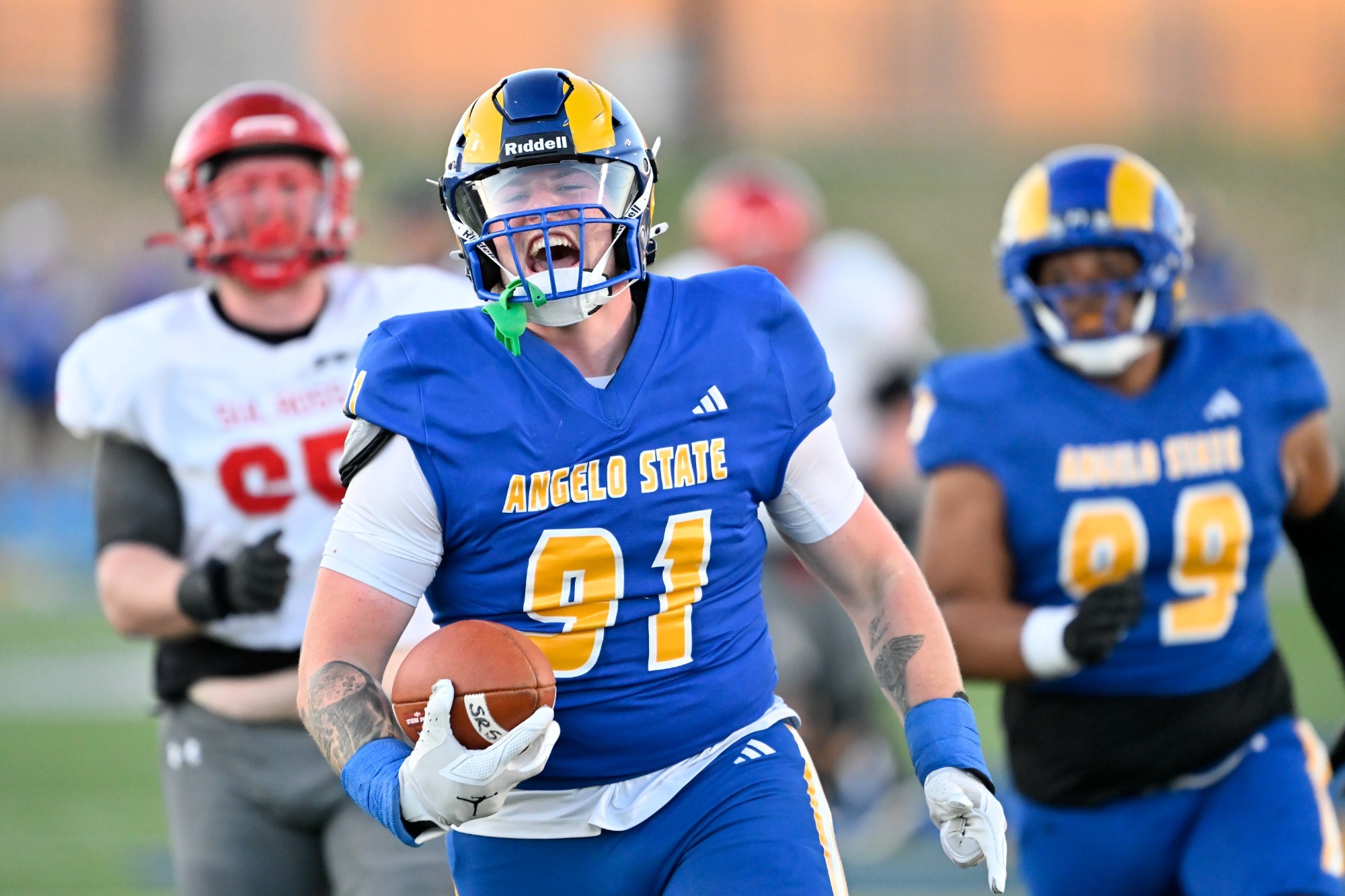 Brody McGee yelling as he returns a fumble for a touchdown
