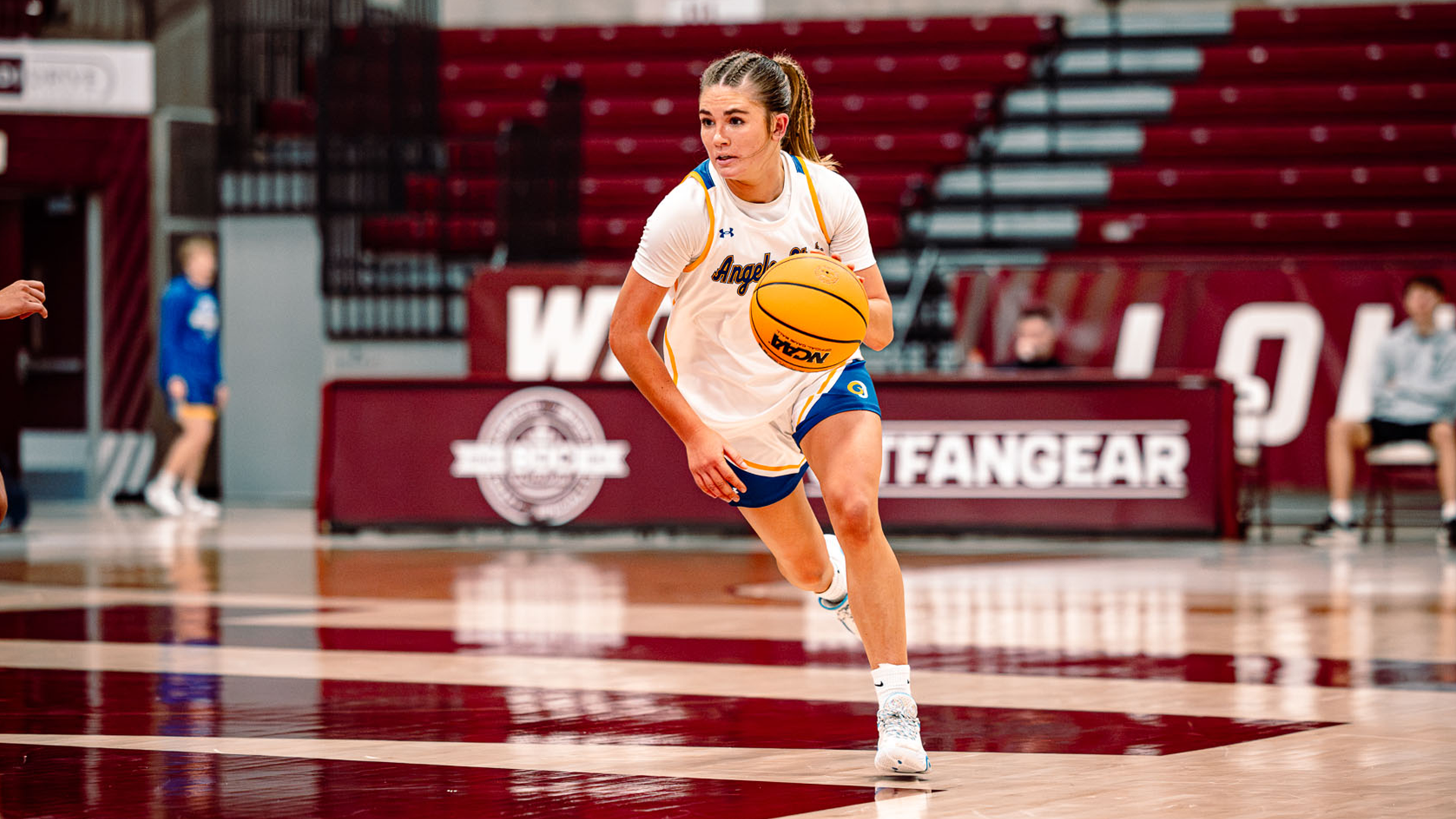 Taylor Grona dribbling down the floor