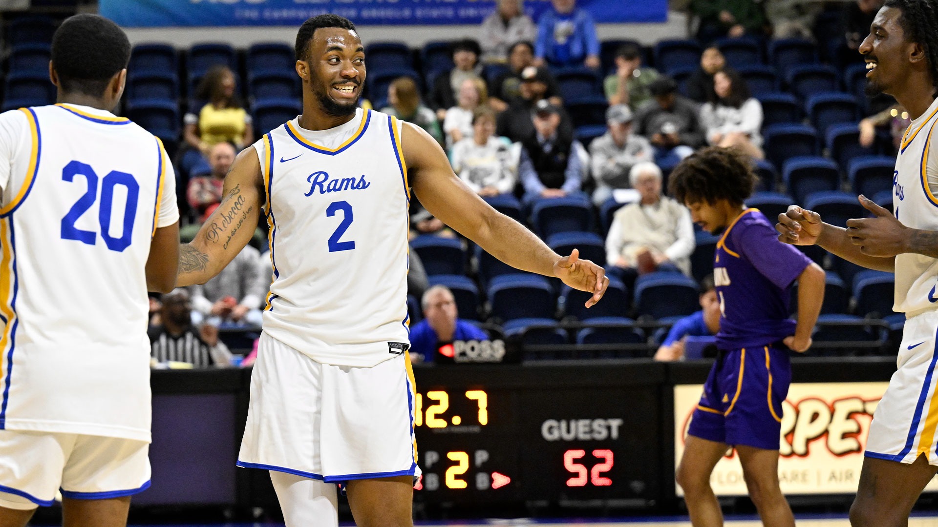Jhordan Ryan high-fives teammates vs. WNMU