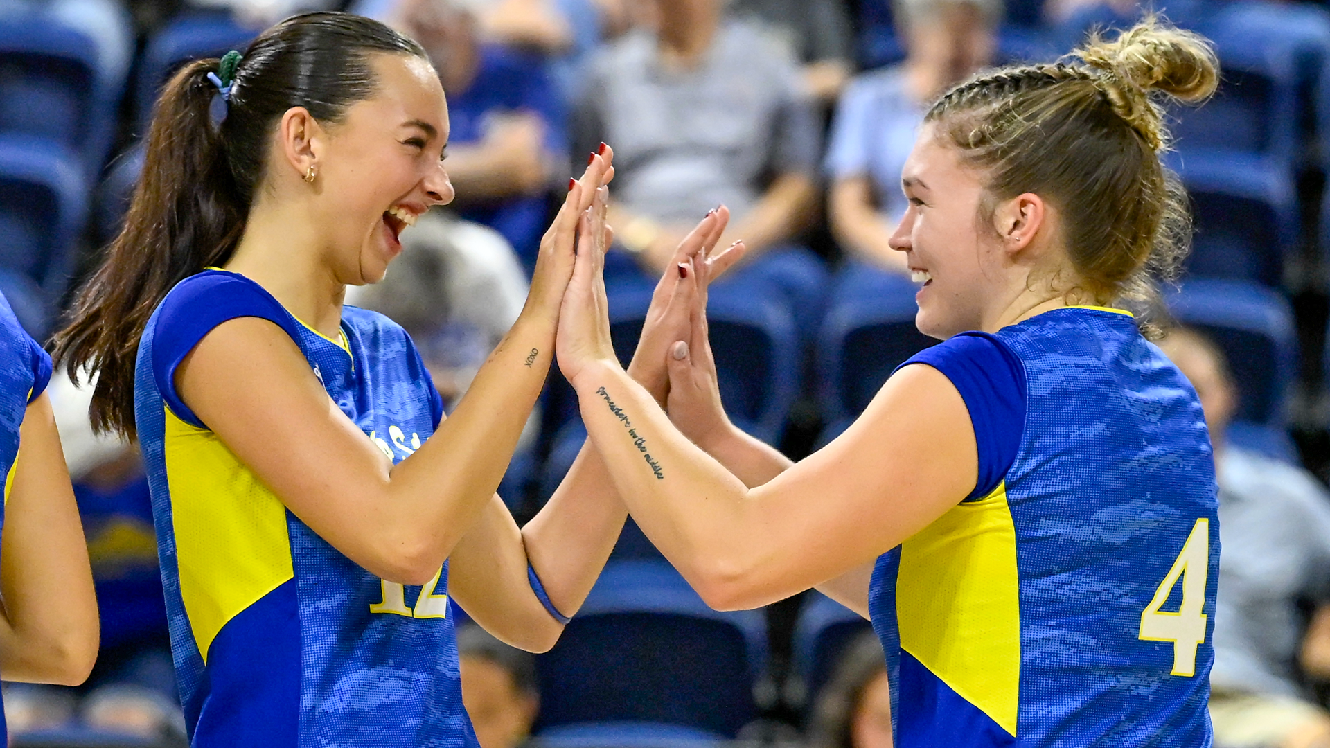 Julia Hopkins and Alli Kirkpatrick celebrate a point