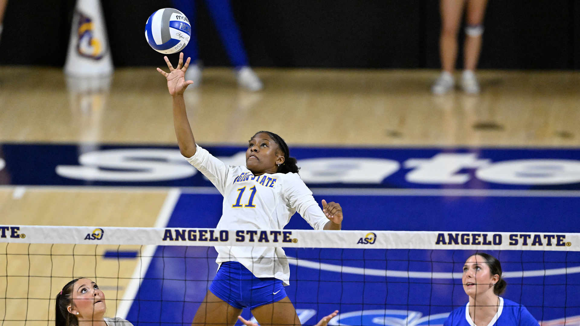 Mary Johnson making a play on the ball at the net