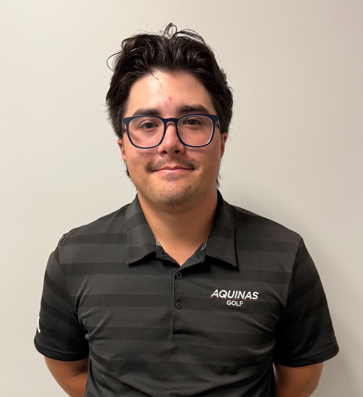 Men's and Women's Golf Coach Matt DenHartigh