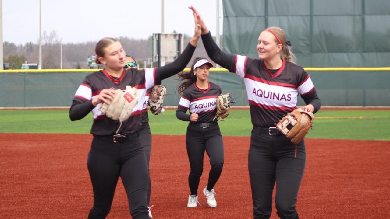 AQ Drops pair to Madonna in WHAC opener