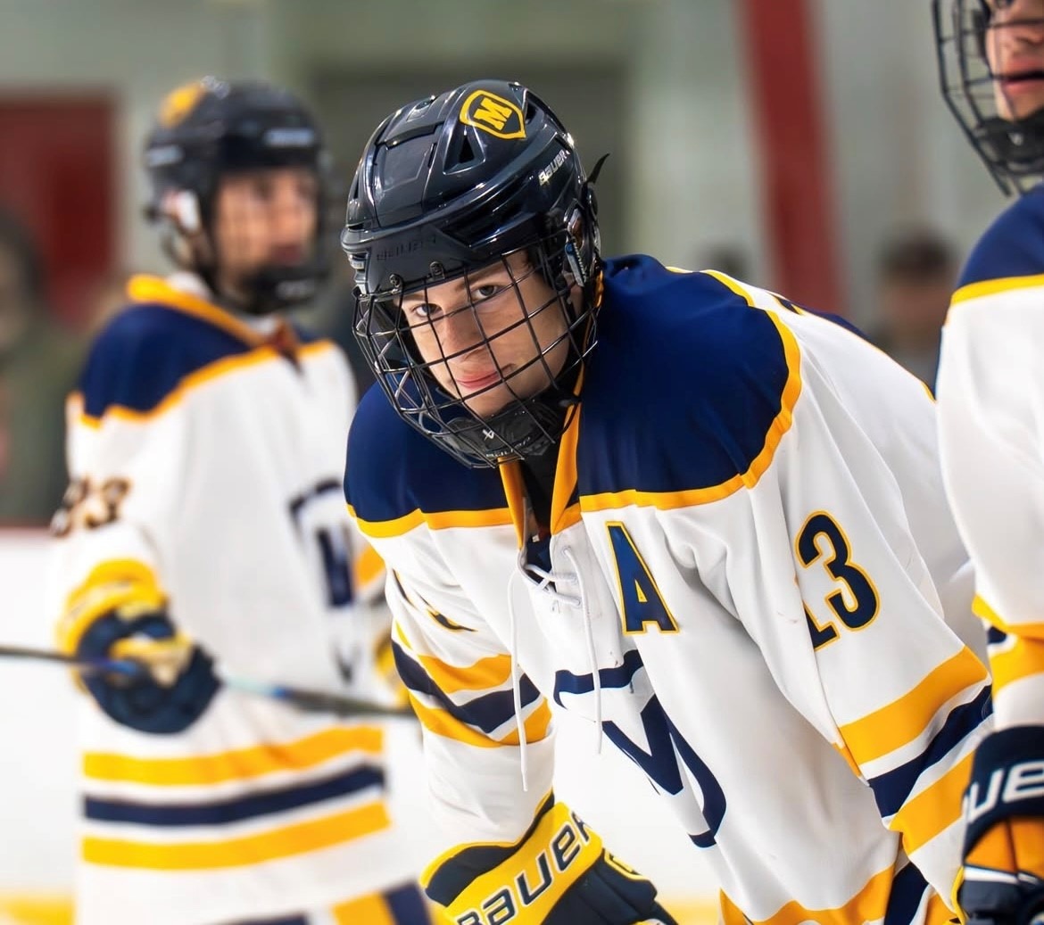 hockey action shot adam milani 