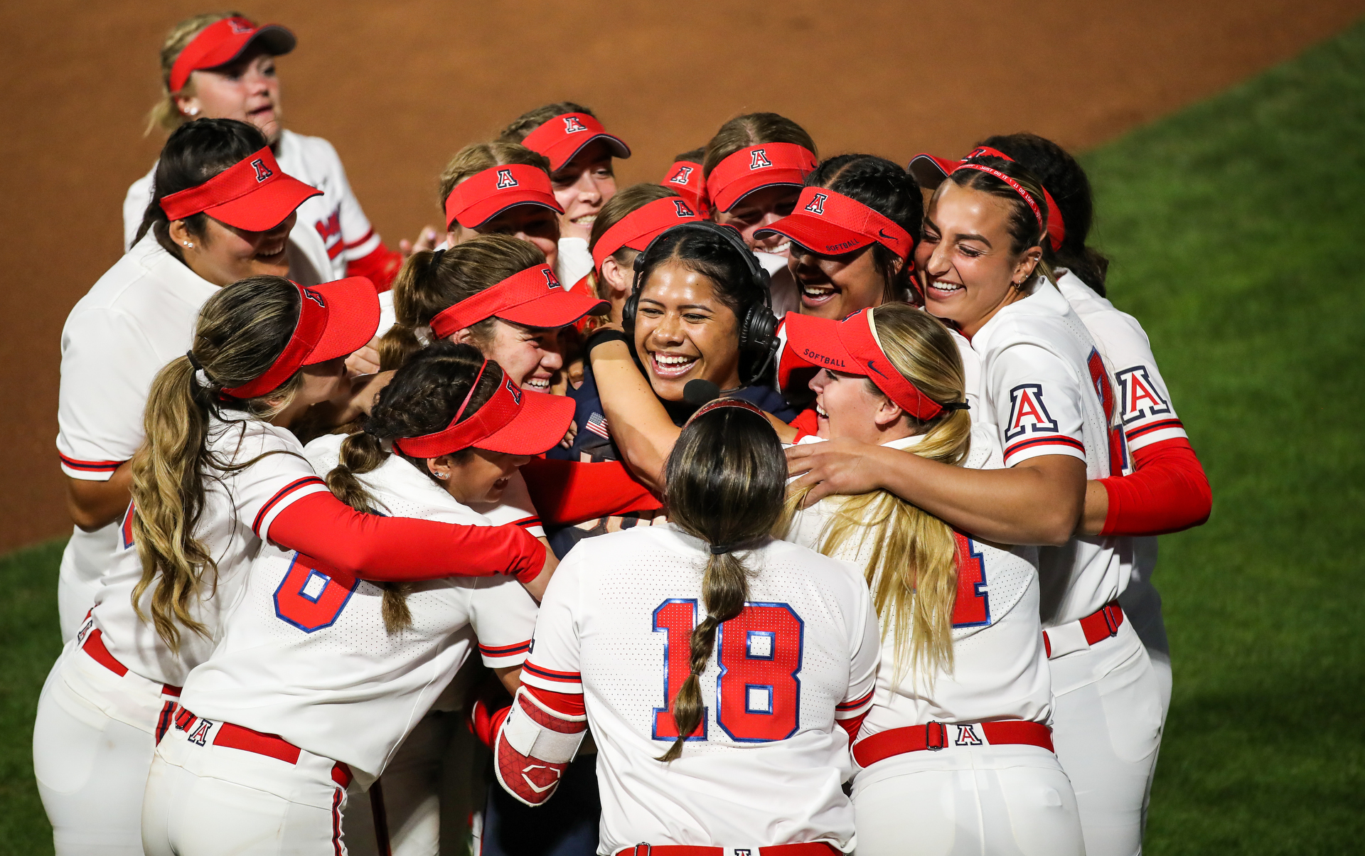 Wildcats mob Dejah Mulipola during her TV interview, Arizona Wildcats softball vs. Team USA 2/18/20 in Tucson, Ariz.Photo by Mike Christy / Arizona Athletics
