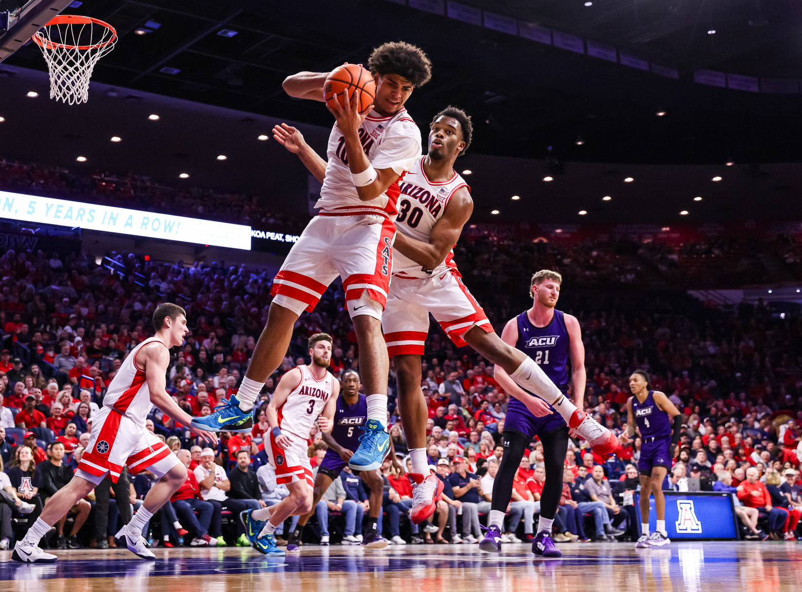 Koa Peat (10), Tobe Awaka (30) — TUCSON, ARIZ. -- Men’s basketball vs. Abilene Christian at McKale Center.Dec. 16, 2025. Photo by Mike Christy / Arizona Athletics