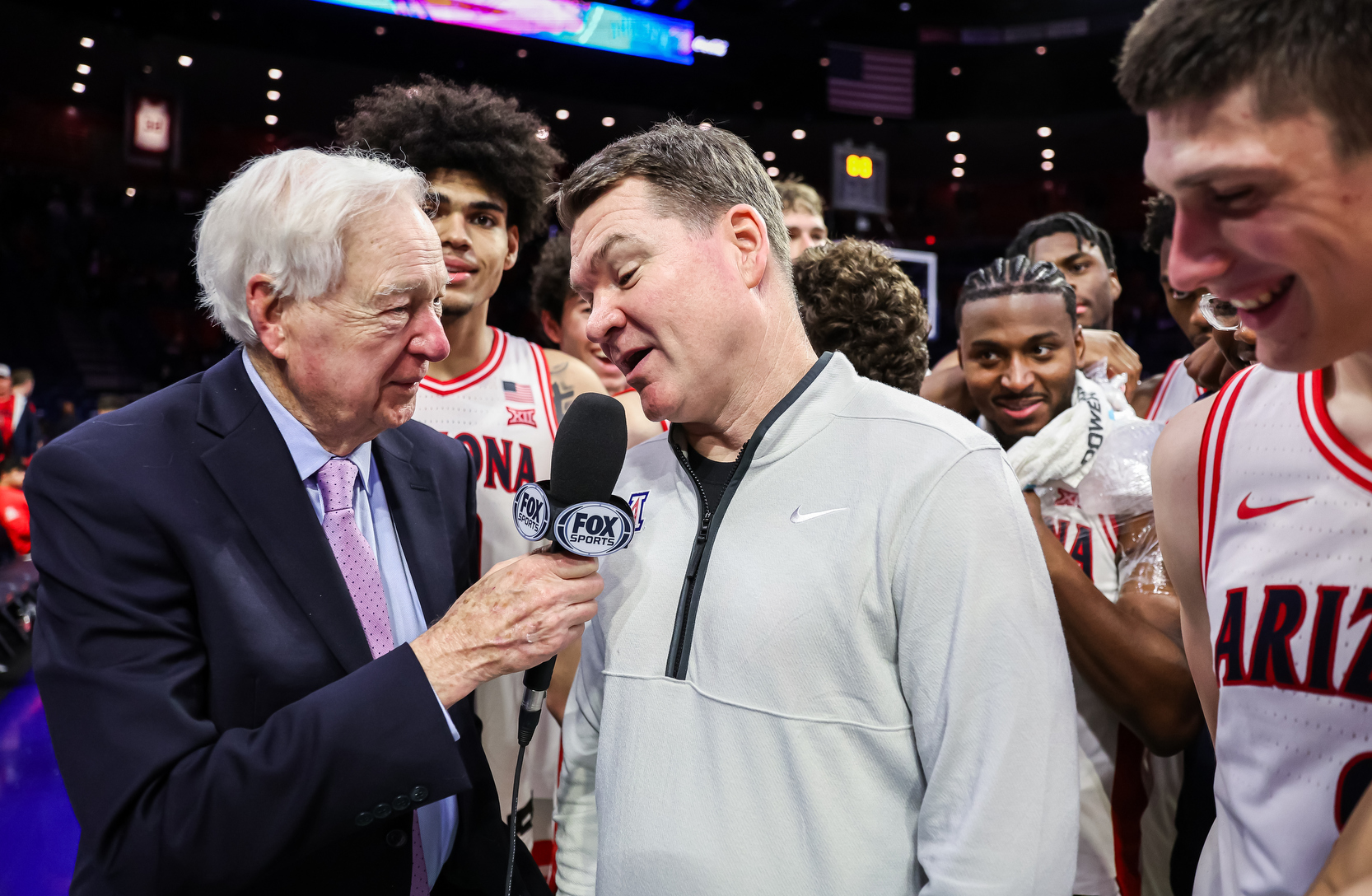 Tommy Lloyd, head coach, Koa Peat (10), Jaden Bradley (0), Ivan Kharchenkov (8) — TUCSON, ARIZ. -- Men’s basketball vs. Kansas State at McKale Center.Jan. 7, 2026. Photo by Mike Christy / Arizona Athletics