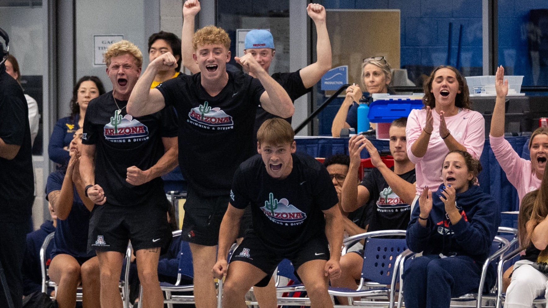 Bo Bridges, Gage DuBois, Colin Gor, Makenna Milne, Allie Sando cheering on 3M Men's Finals