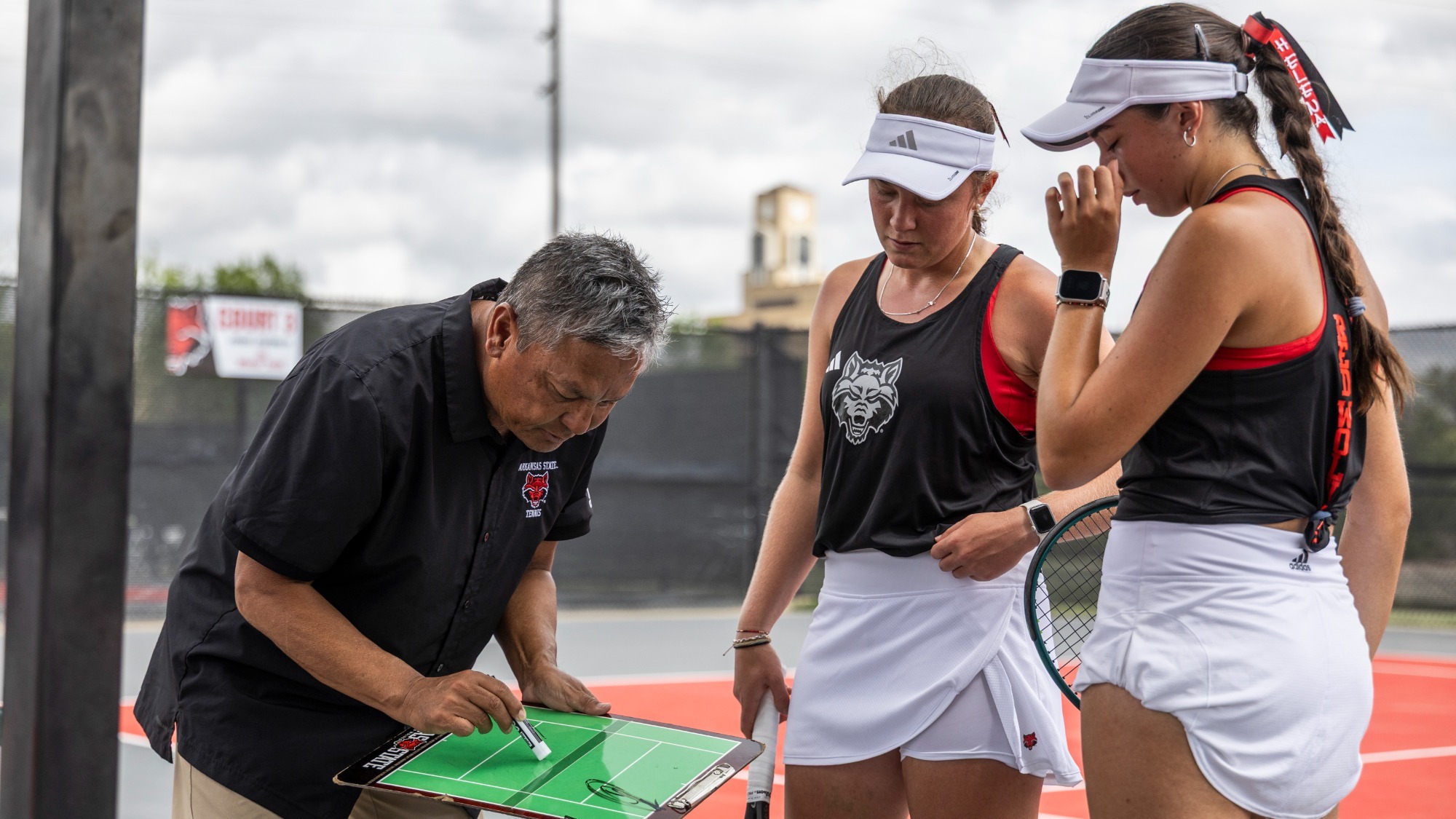 Sujay Lama with Hanmare McAslin and Helena Bueno in match against UAB 