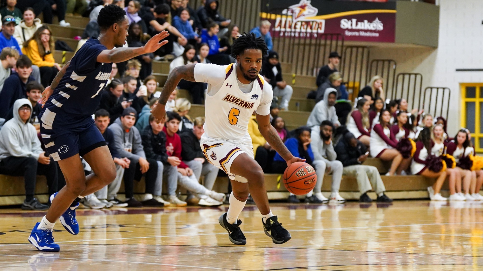 Rasheem Dearry dribbles towards the basket