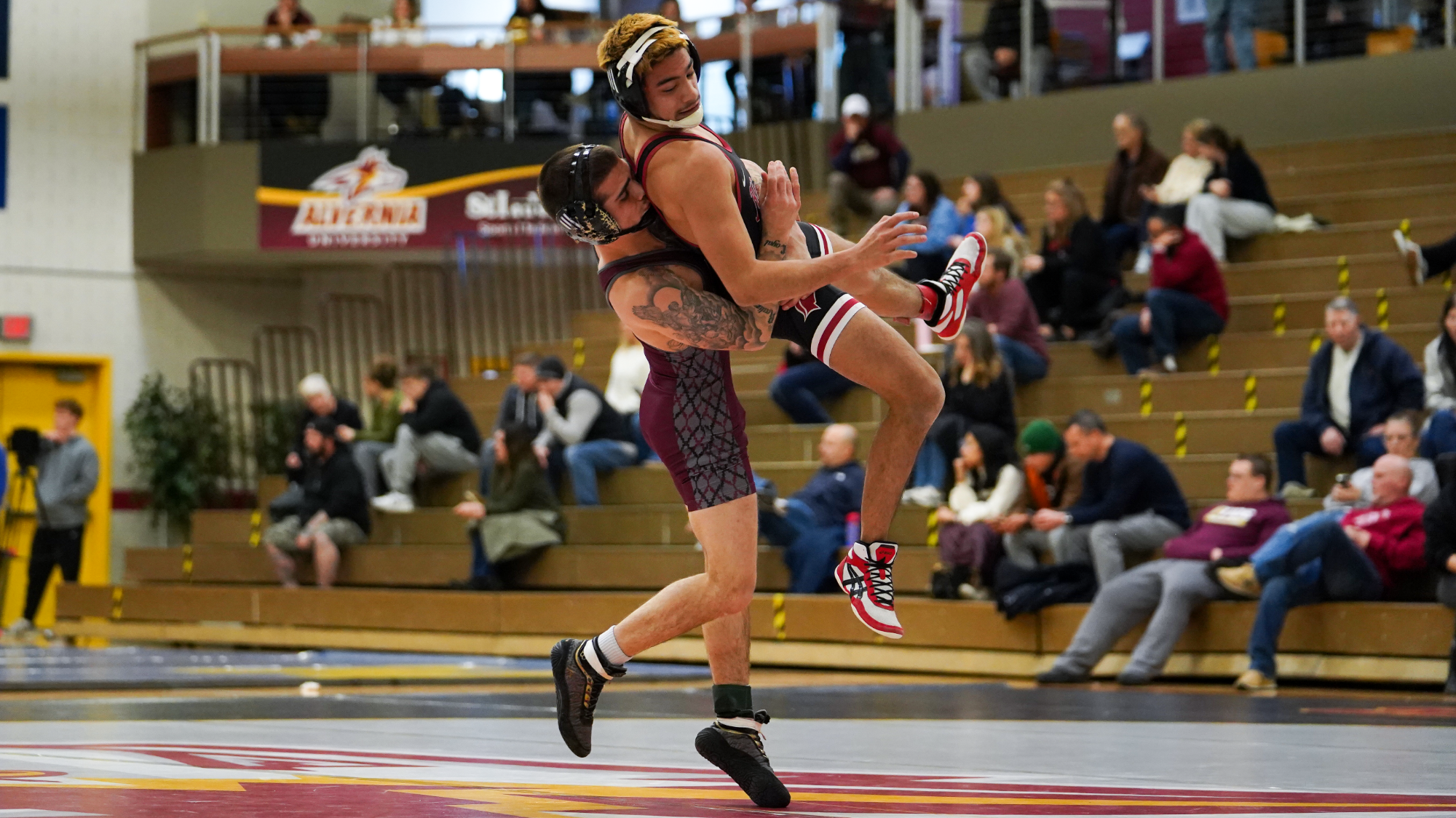 Ethan Staples suplexes SVU wrestler