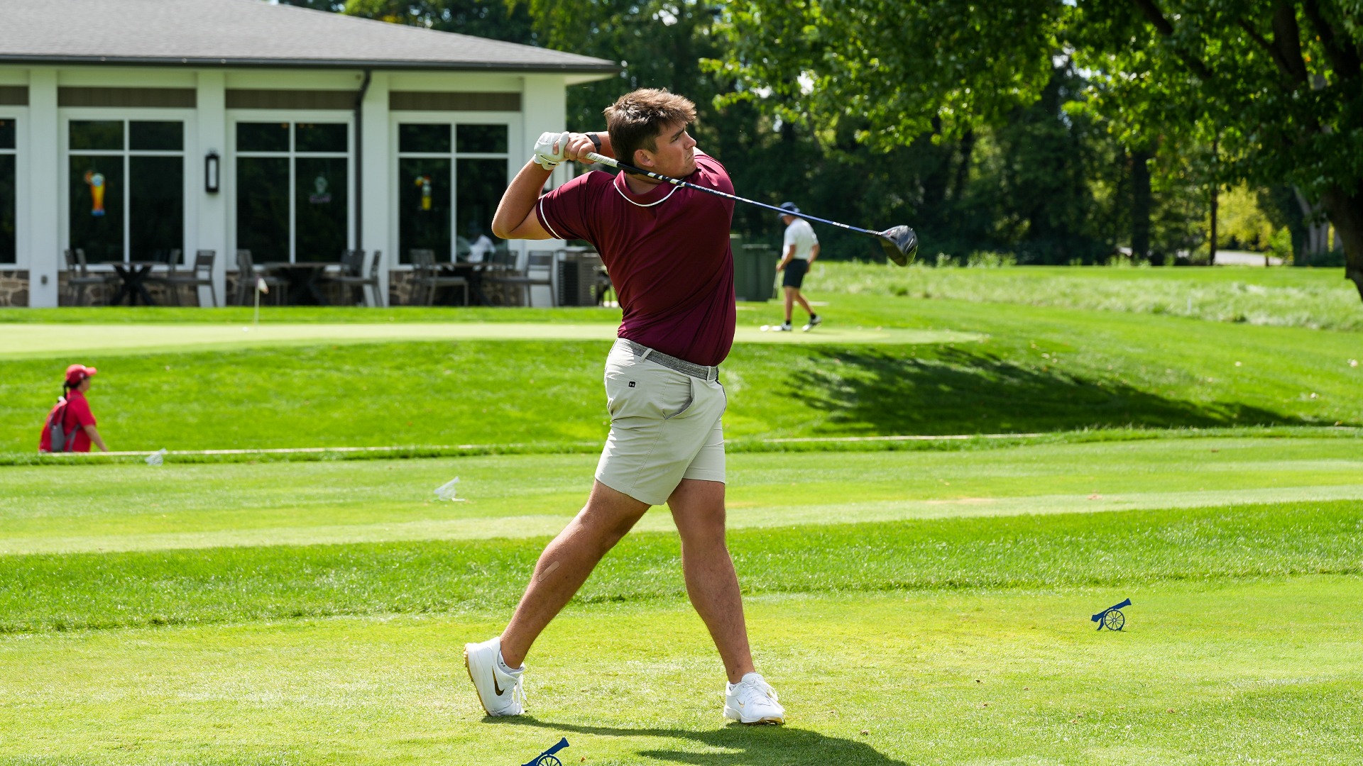 Matthew Overholt hits a tee shot. 