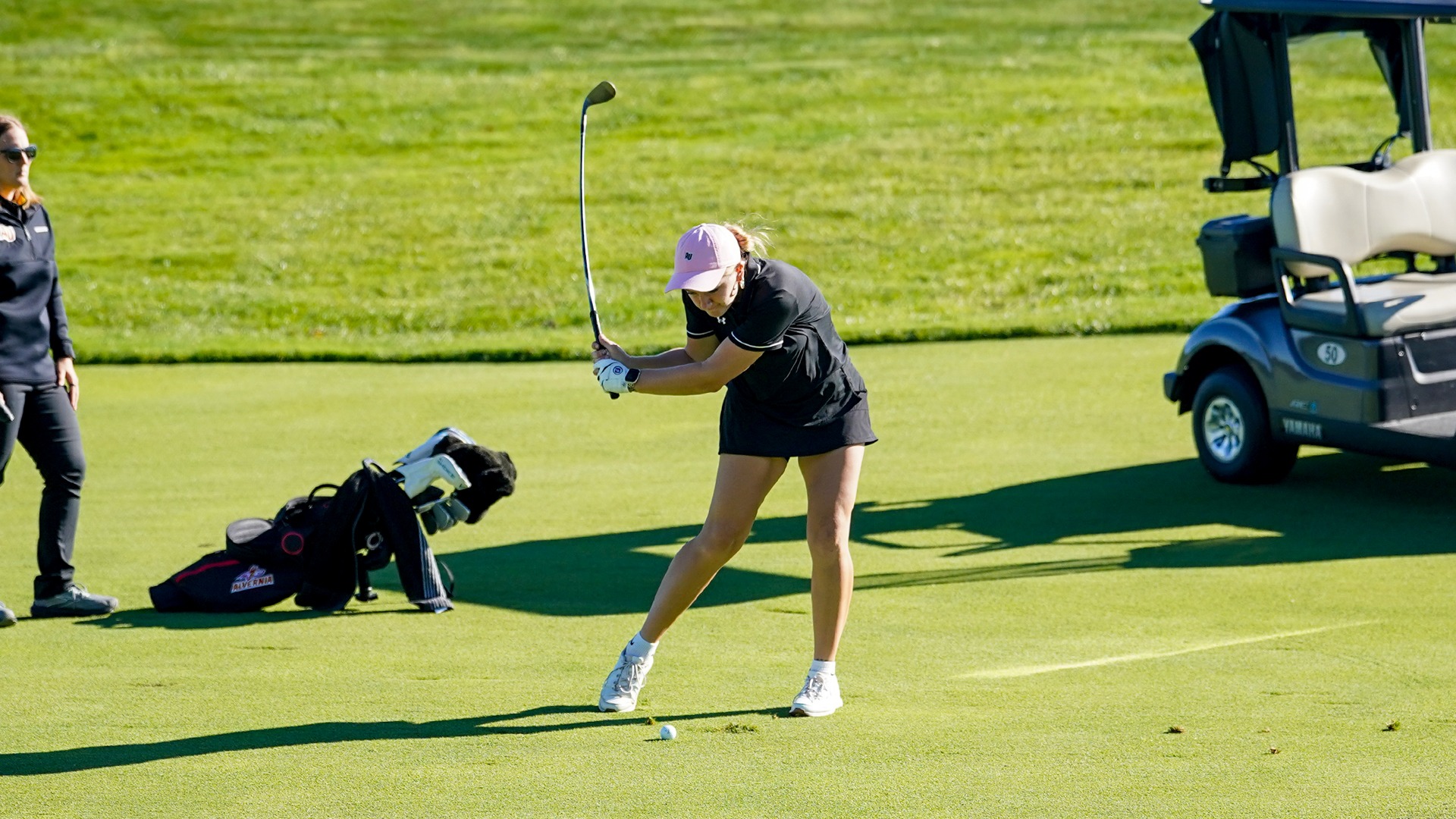 Ayvah Rossi hits her approach shot into eight green. 