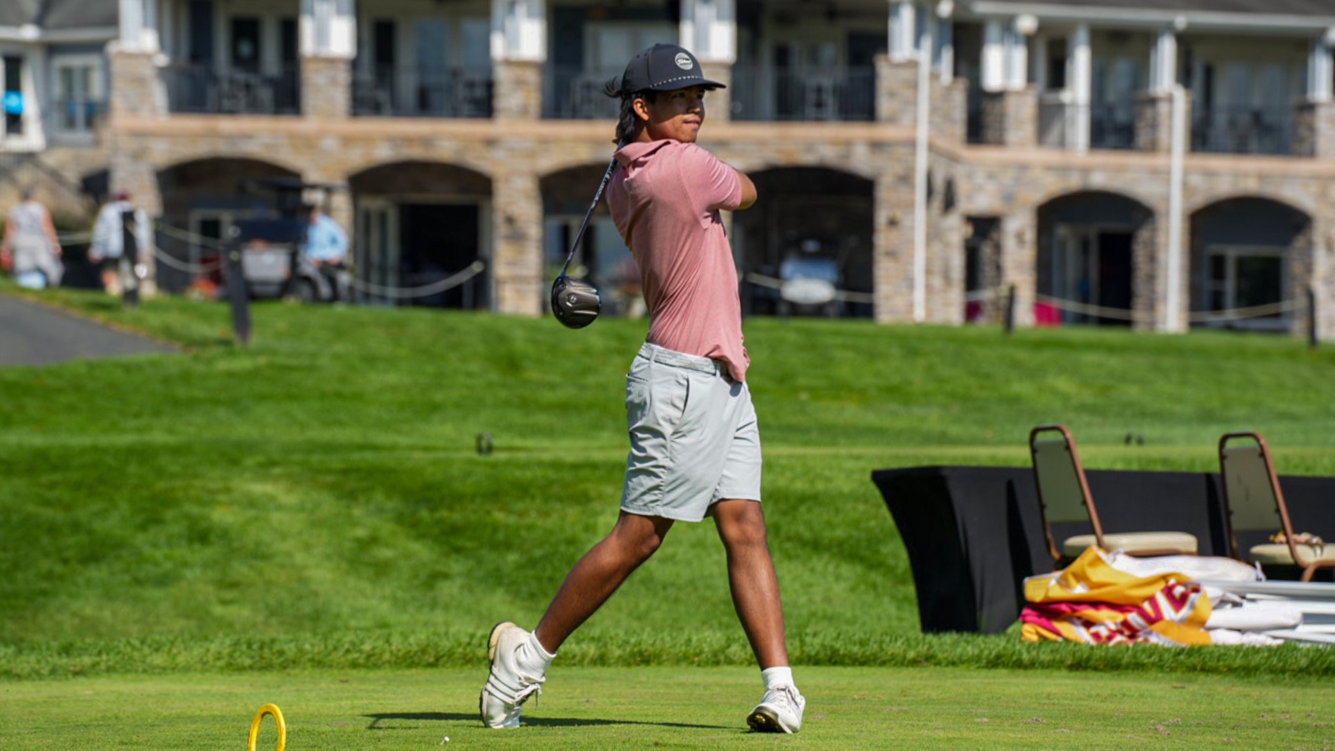 Zhan Medina tee's off. 