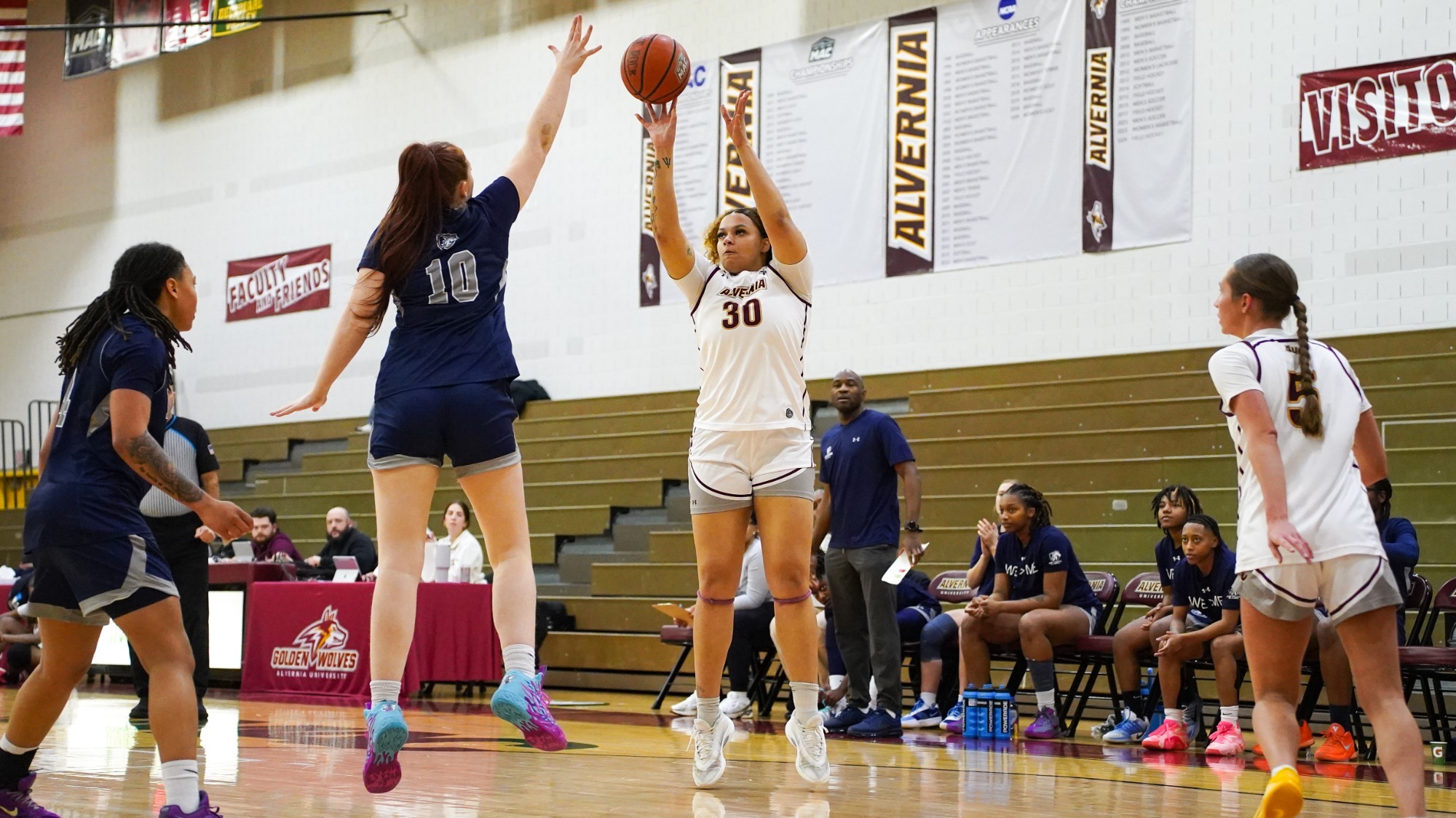 Jennah DeGout takes a mid-range jump shot