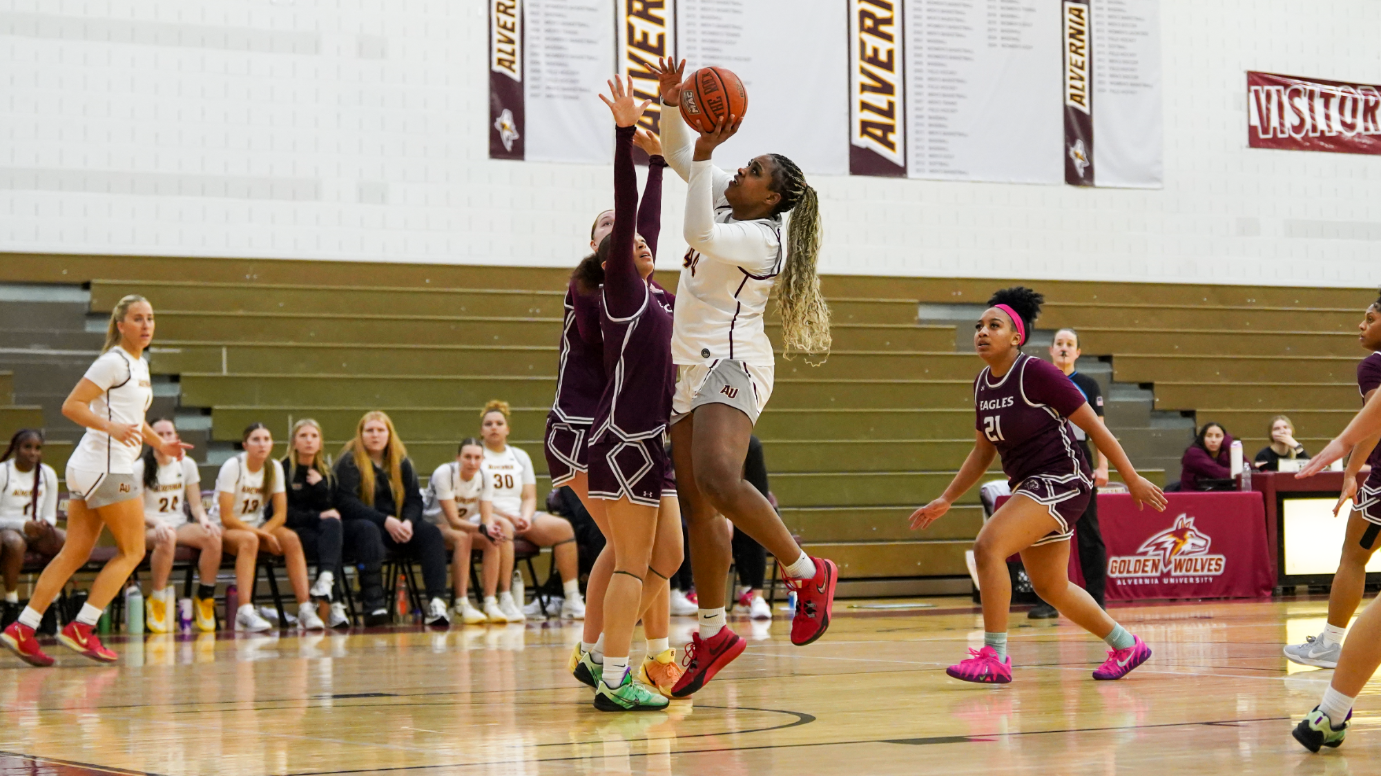 Taryn Woodson finishes a layup through contact