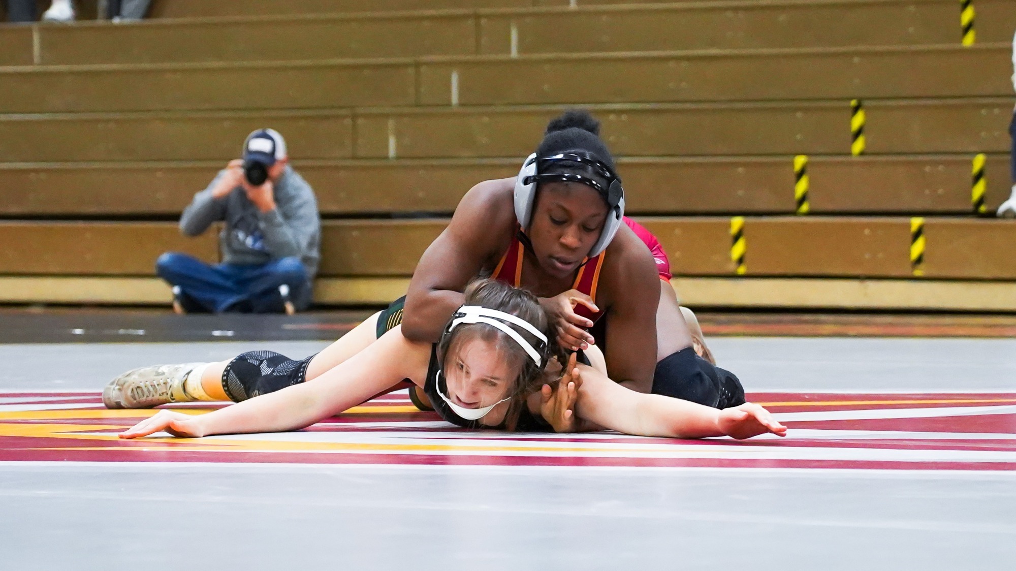 Liz Adebola wrestles against Cedar Crest