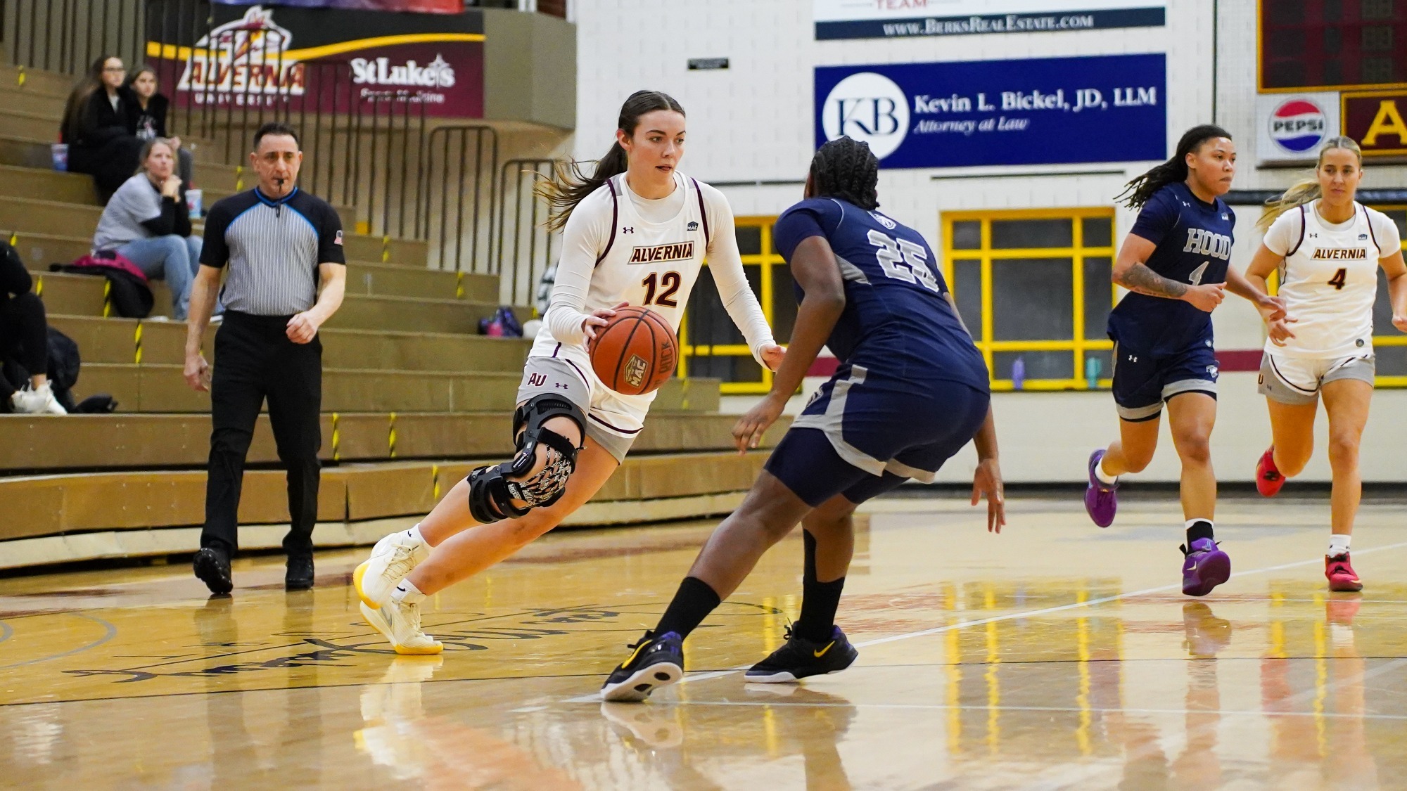 Meghan Ruth dribbles by her defender