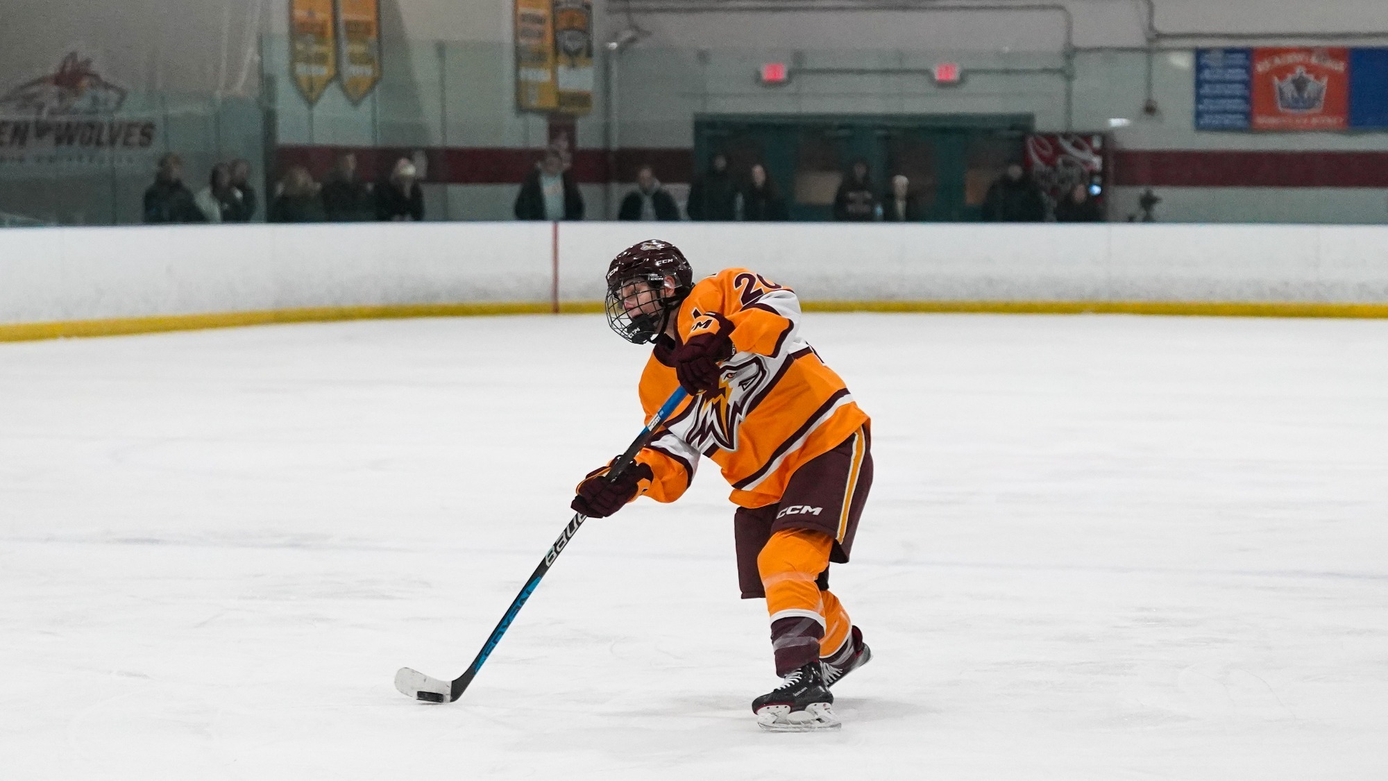 Gillian Evans sends a puck toward the goal.