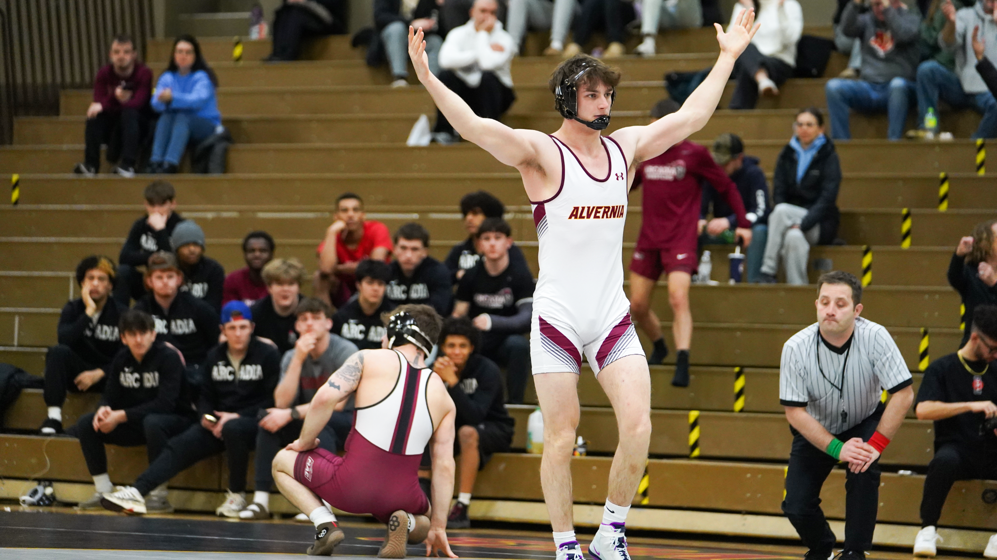 Hayden McLellan celebrates after pinning his opponent