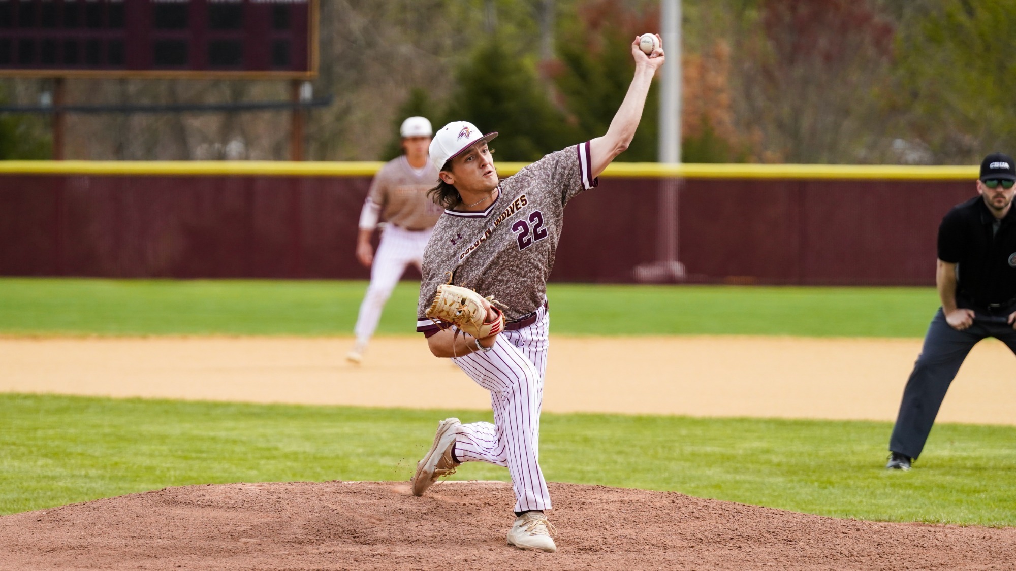 Chris Sasso fires a pitch toward home plate in home game against crosstown rival Albright in Angelica Park. 