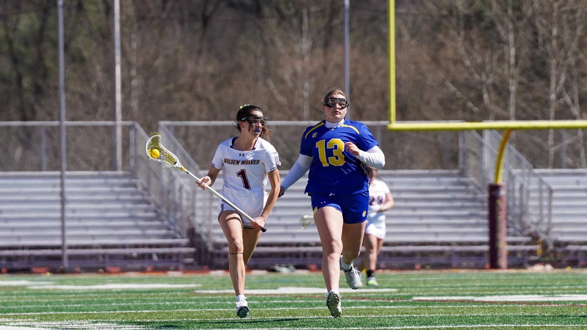 Grace Weissenberger runs through the midfield against a Misericordia defender