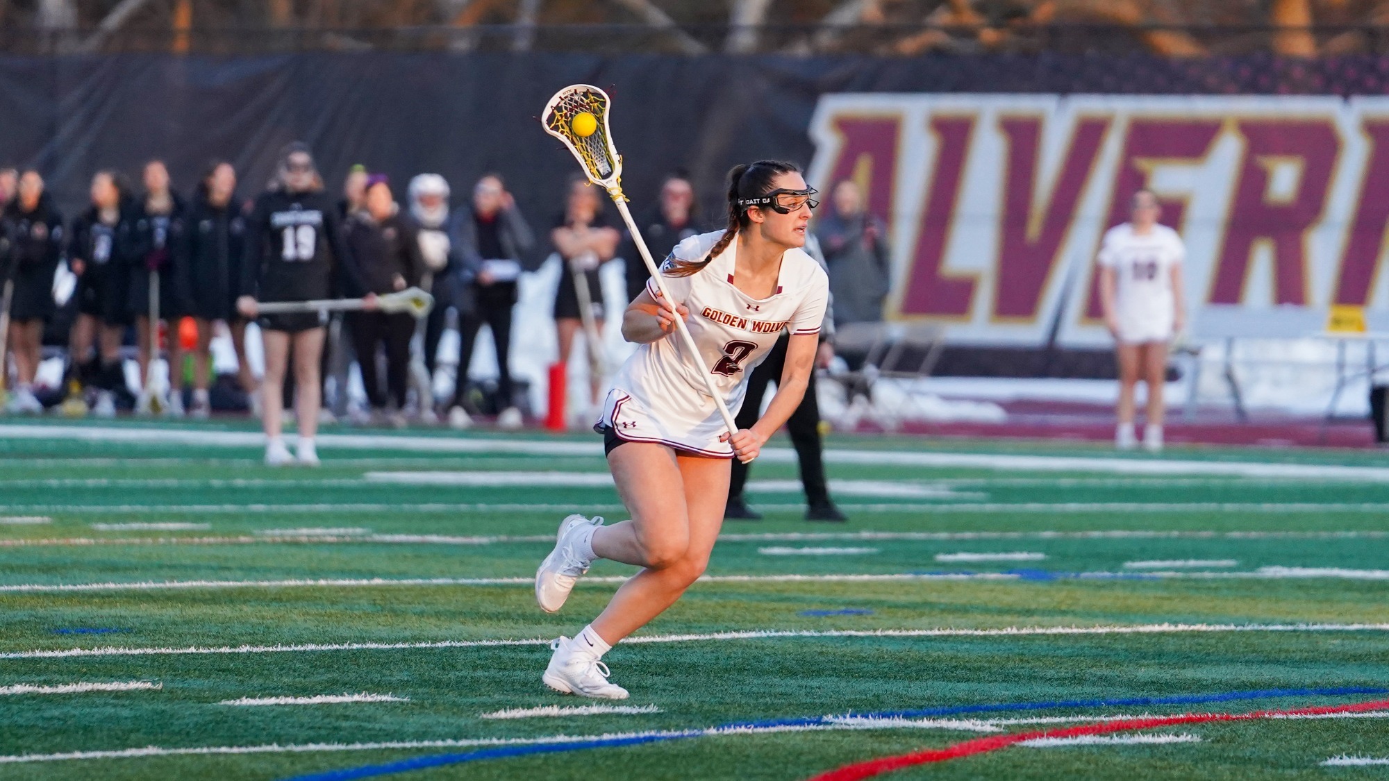 Makenna Thomas drives in for a shot 