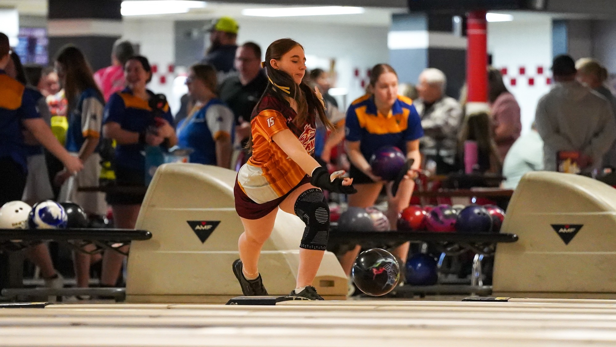 Paige Aucker bowls a strike