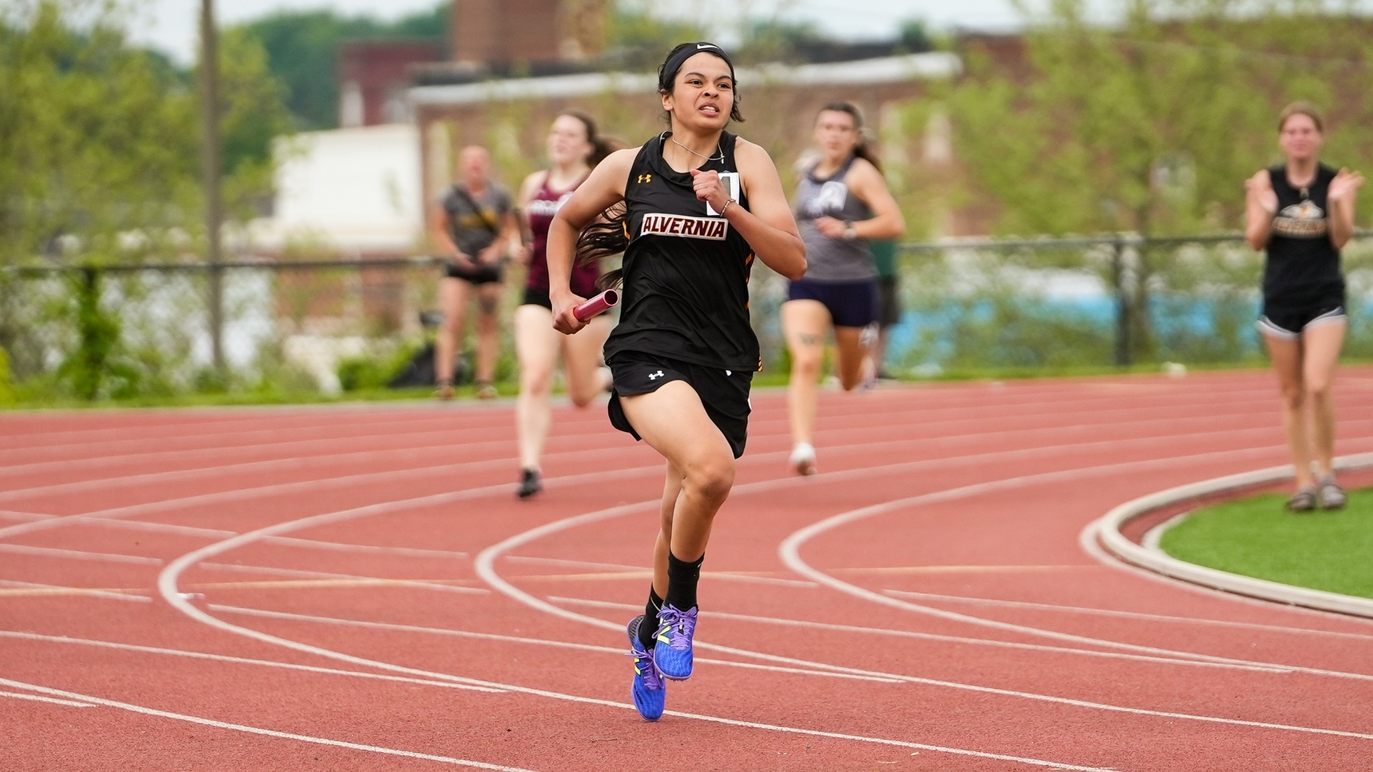 Addy Gularte runs the turn in the 400 meter