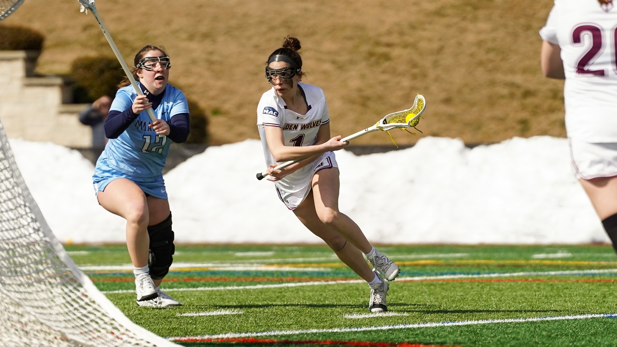 Grace Weissenberger drives to the goal through her defender