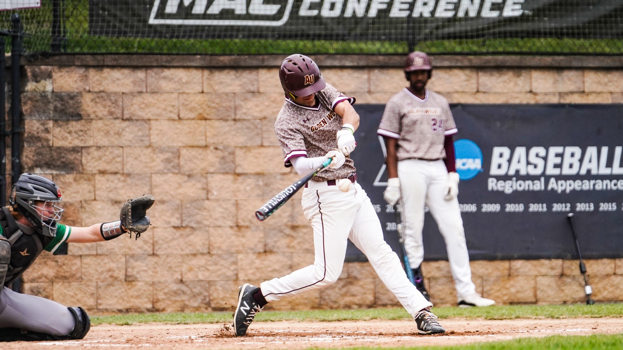 Timmy Hitchcock rips a single into the outfield in a game against York College in Angelica Park
