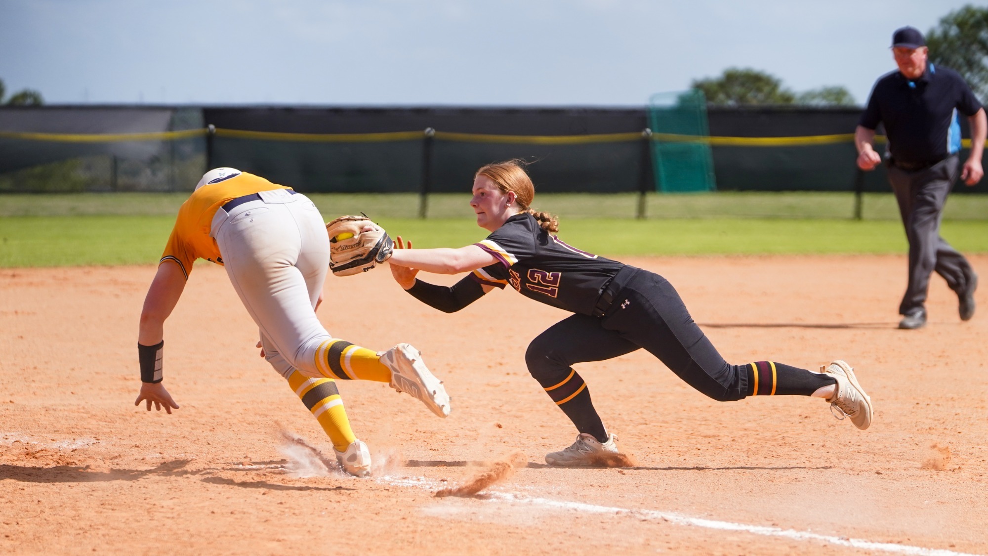 Savannah Richards dives for a tagout against Neumann