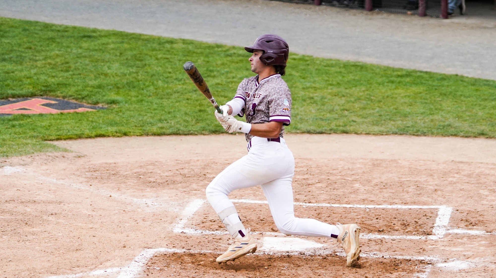 Mike Pulcini rips a ball into the outfield against York College down in Angelica Park