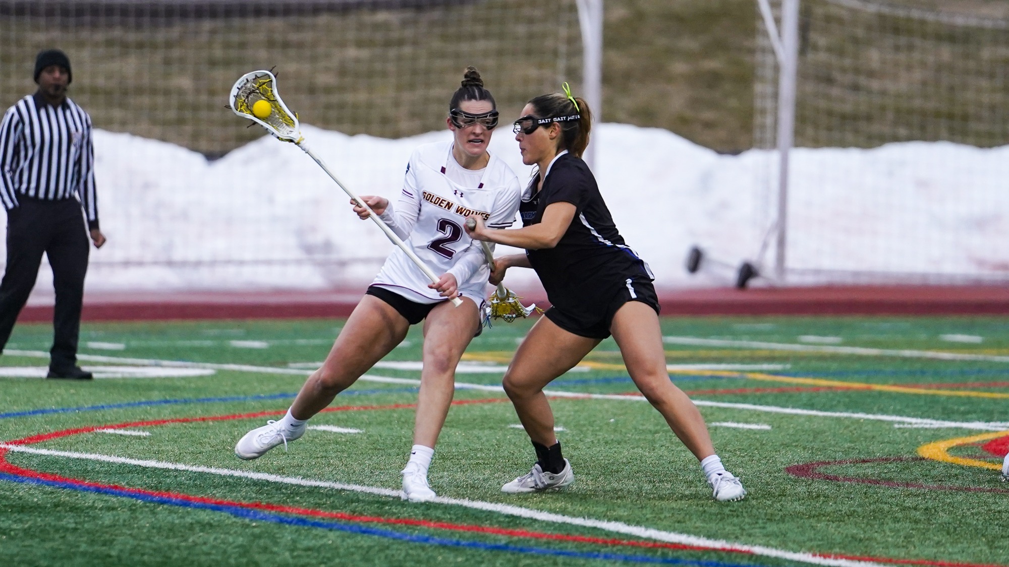Makenna Thomas drives against her opponent in the offensive zone