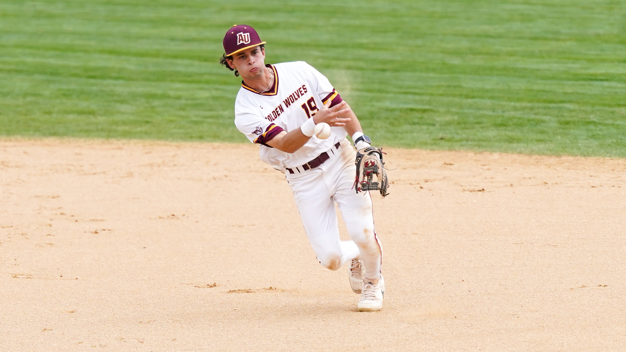 Mike Pulcini makes a play to first base