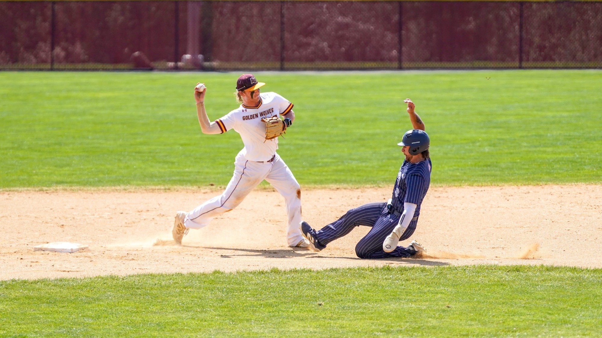 Bobby Hansen turns a double play against Hood