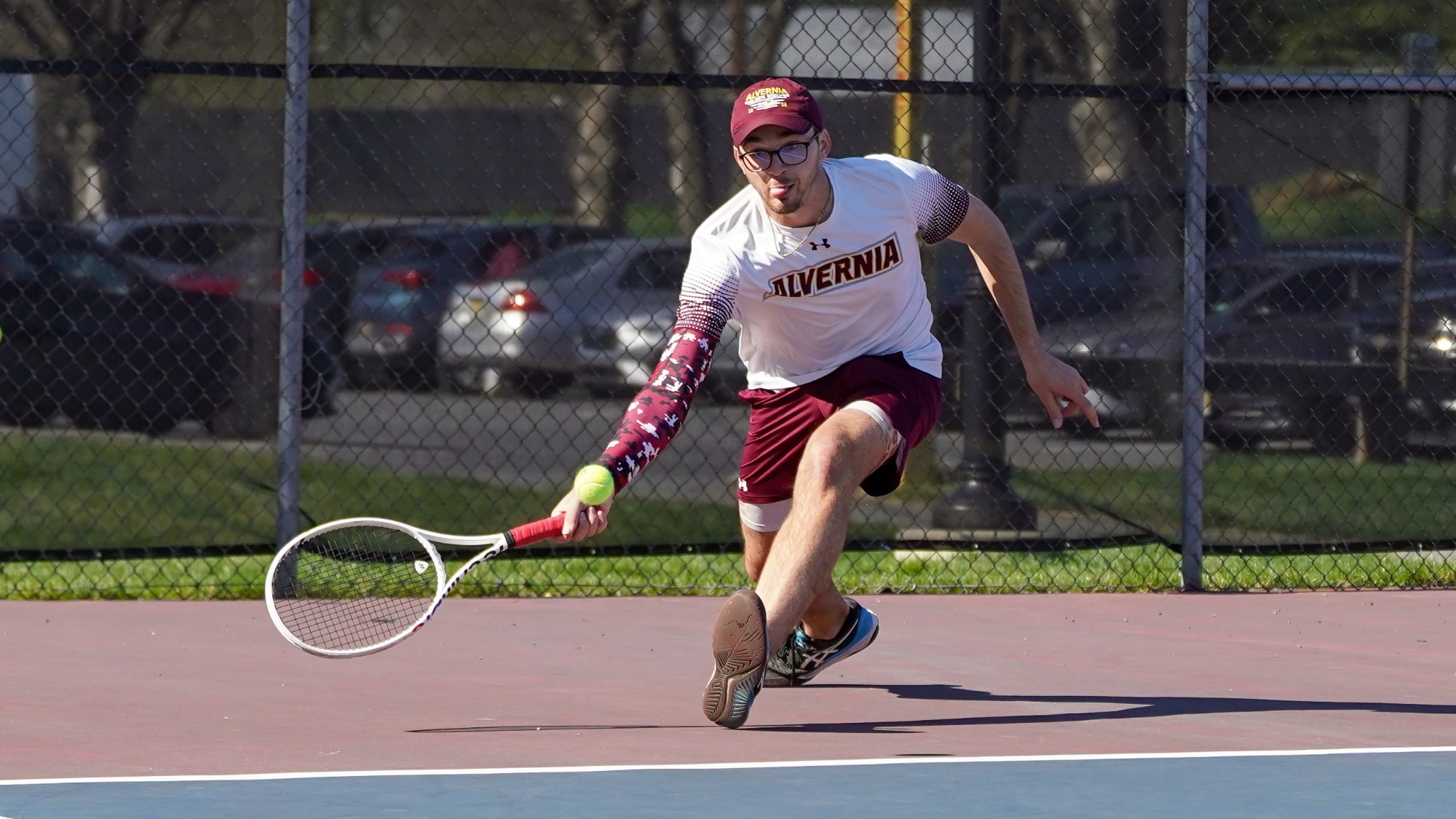 Luke Brisbois returns a serve