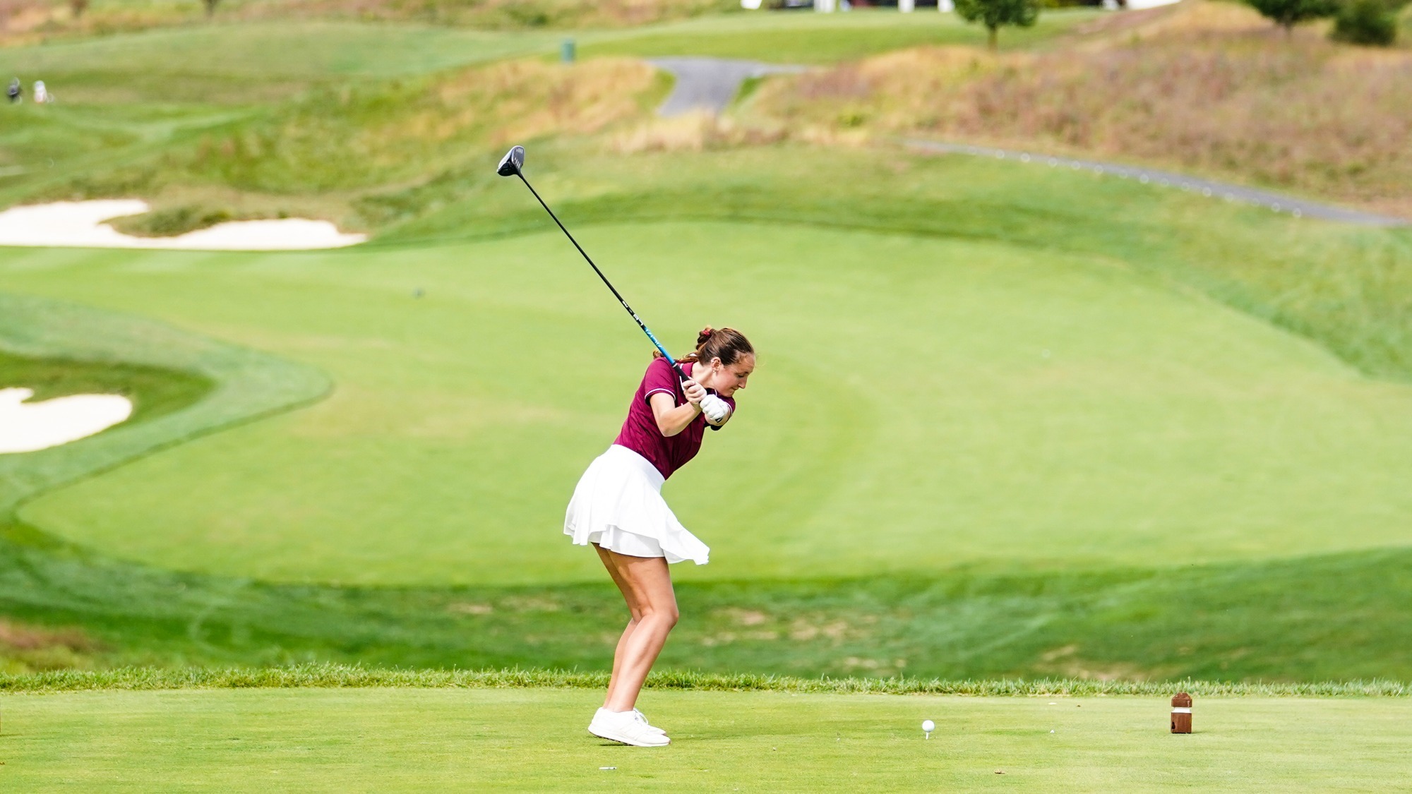 Grace Spielman hits a tee shot off of the 16th tee at LedgeRock Golf Club.