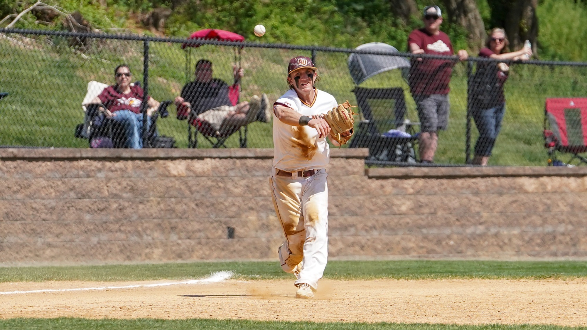 Bobby Hansen throws a ball to first base
