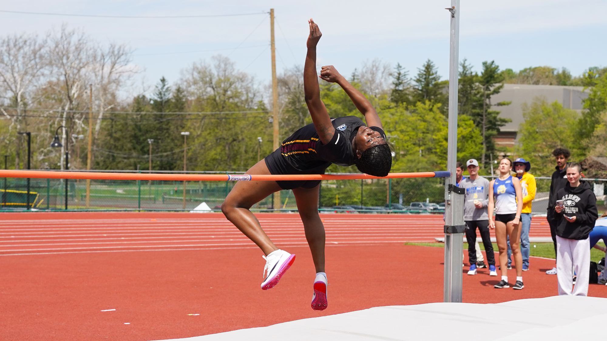 Britney Anyia clears the high jum pole
