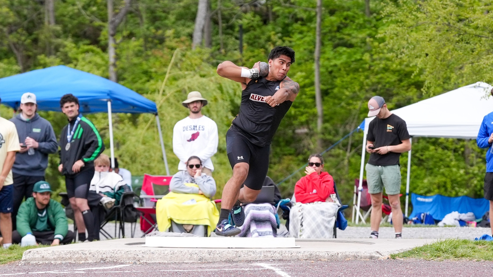 Christian Medina competes in Shot Put at MAC Championship