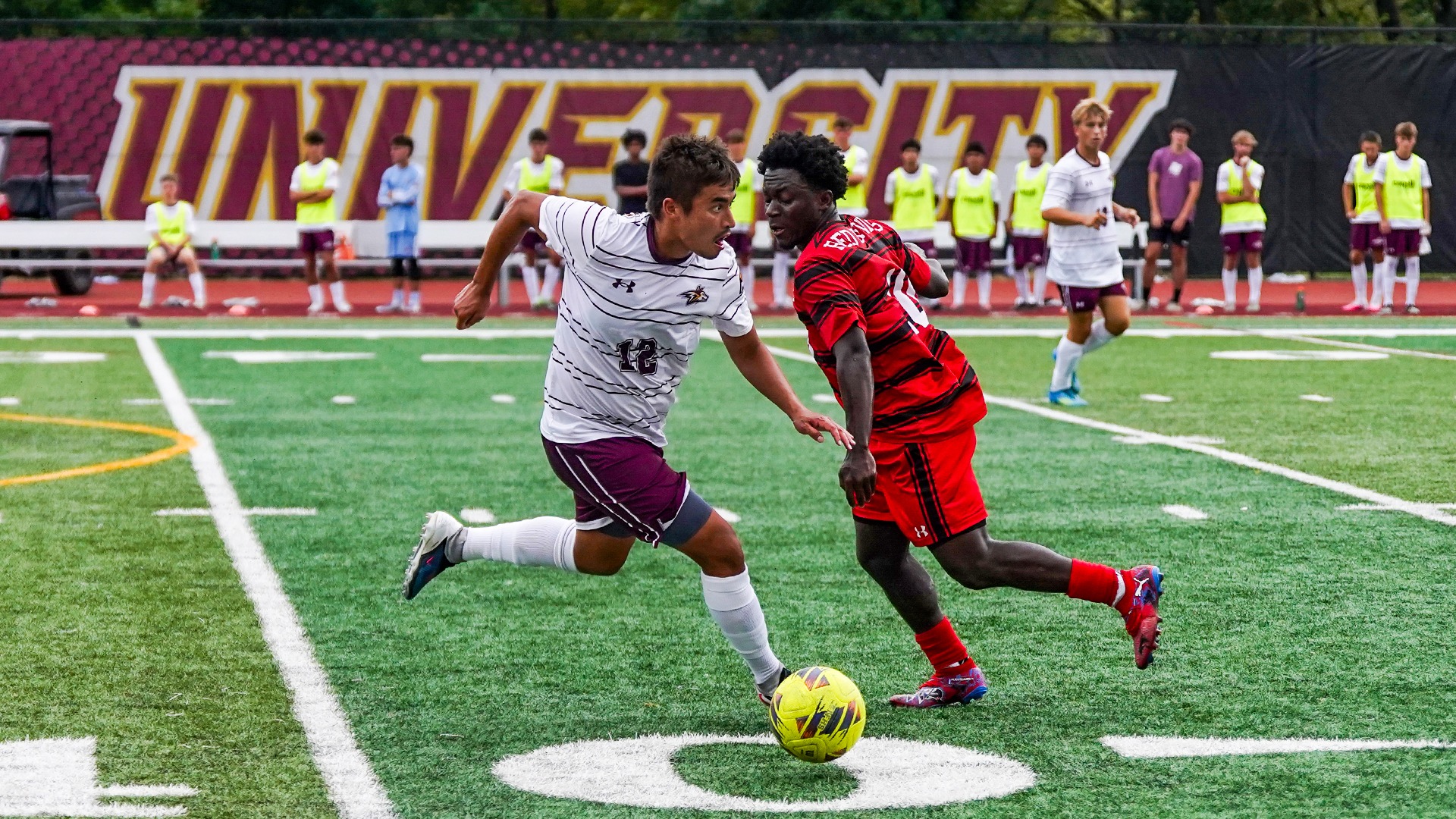 Brendan Corpus dribbles by a defender