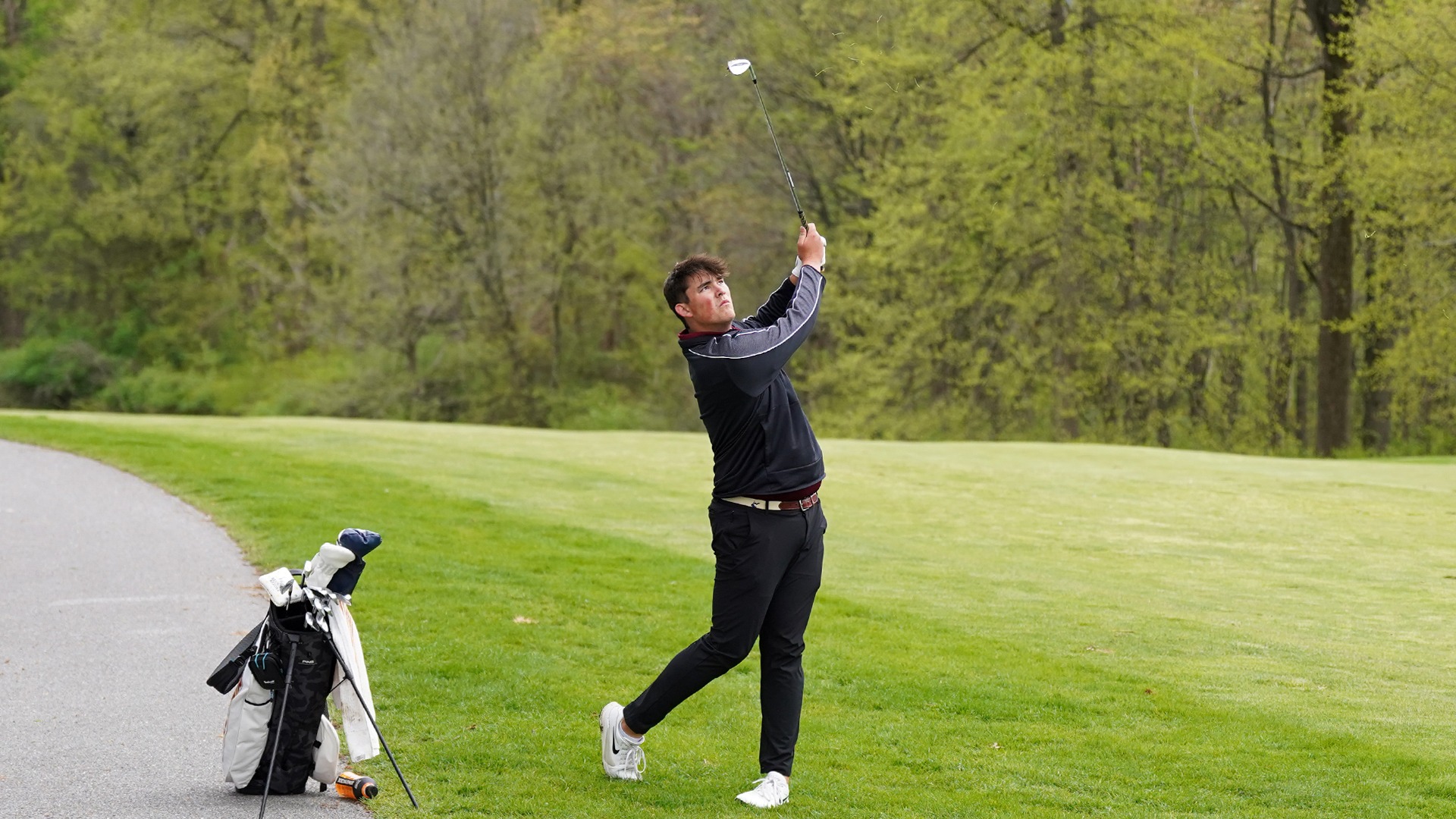 Matthew Overholt hits an approach shot into 16 green. 