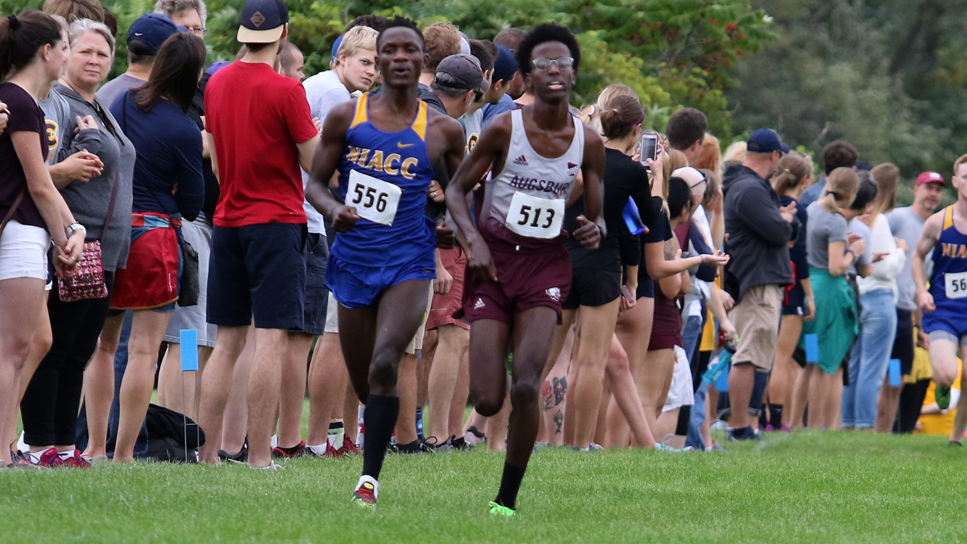 Sakariya Hussein sprints during a 2019 Augsburg men's cross country meet.